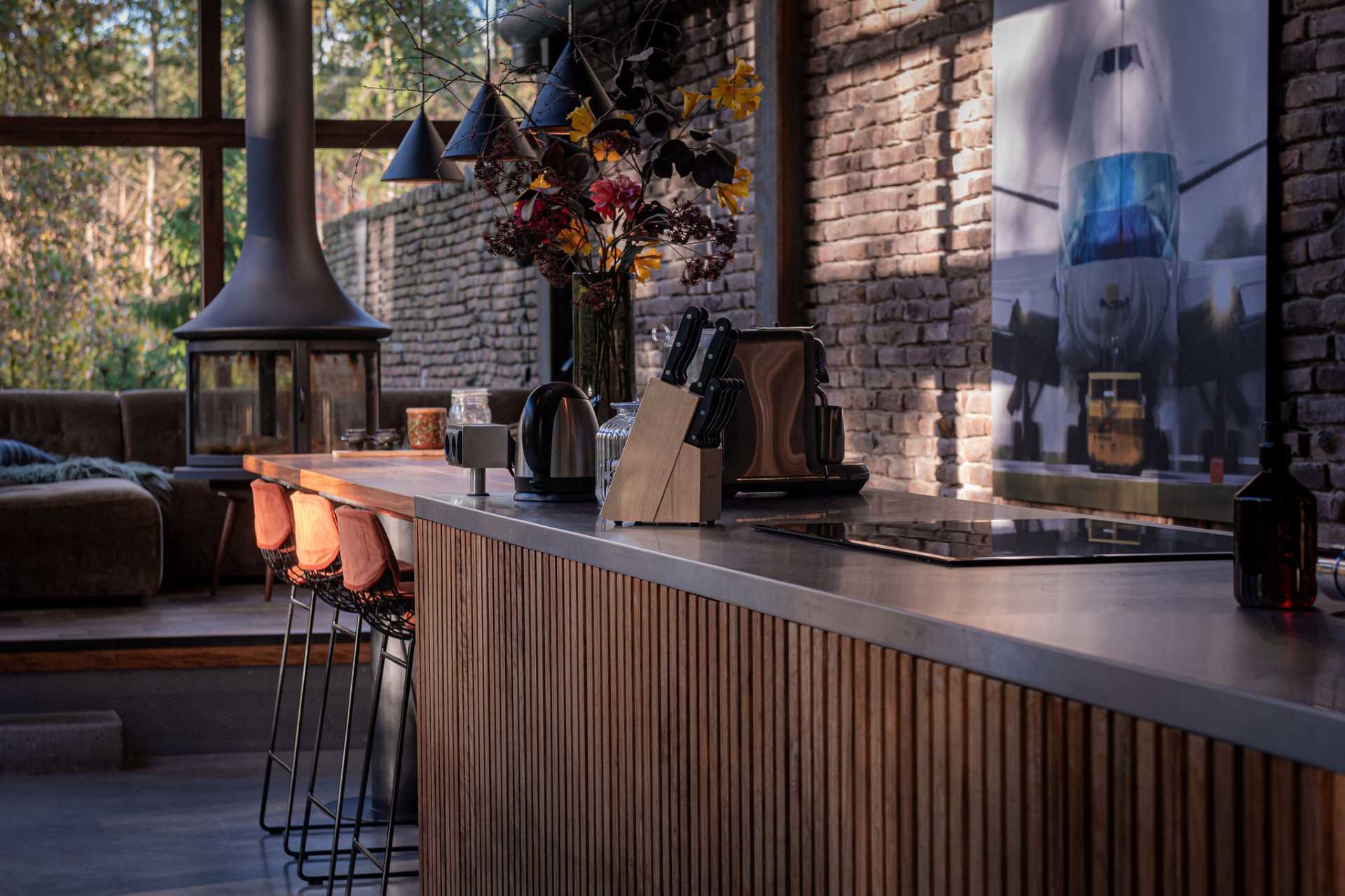 A modern kitchen with a wood bar.