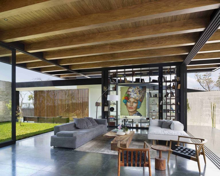 The Exposed Wood Ceiling Of This Home Shows Off Its Structure