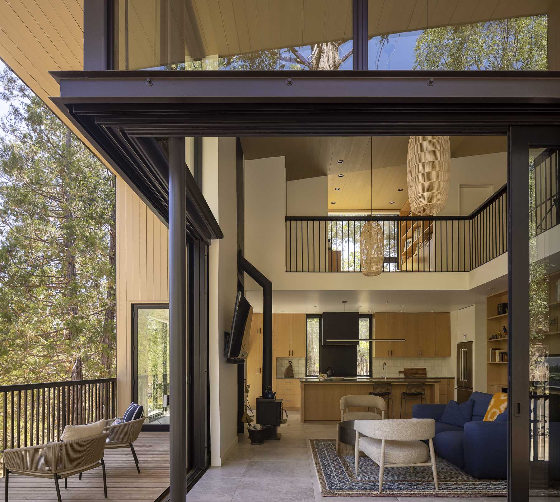 Large sliding glass doors slide open to allow the living room to connect with the deck, creating an indoor/outdoor living experience. 