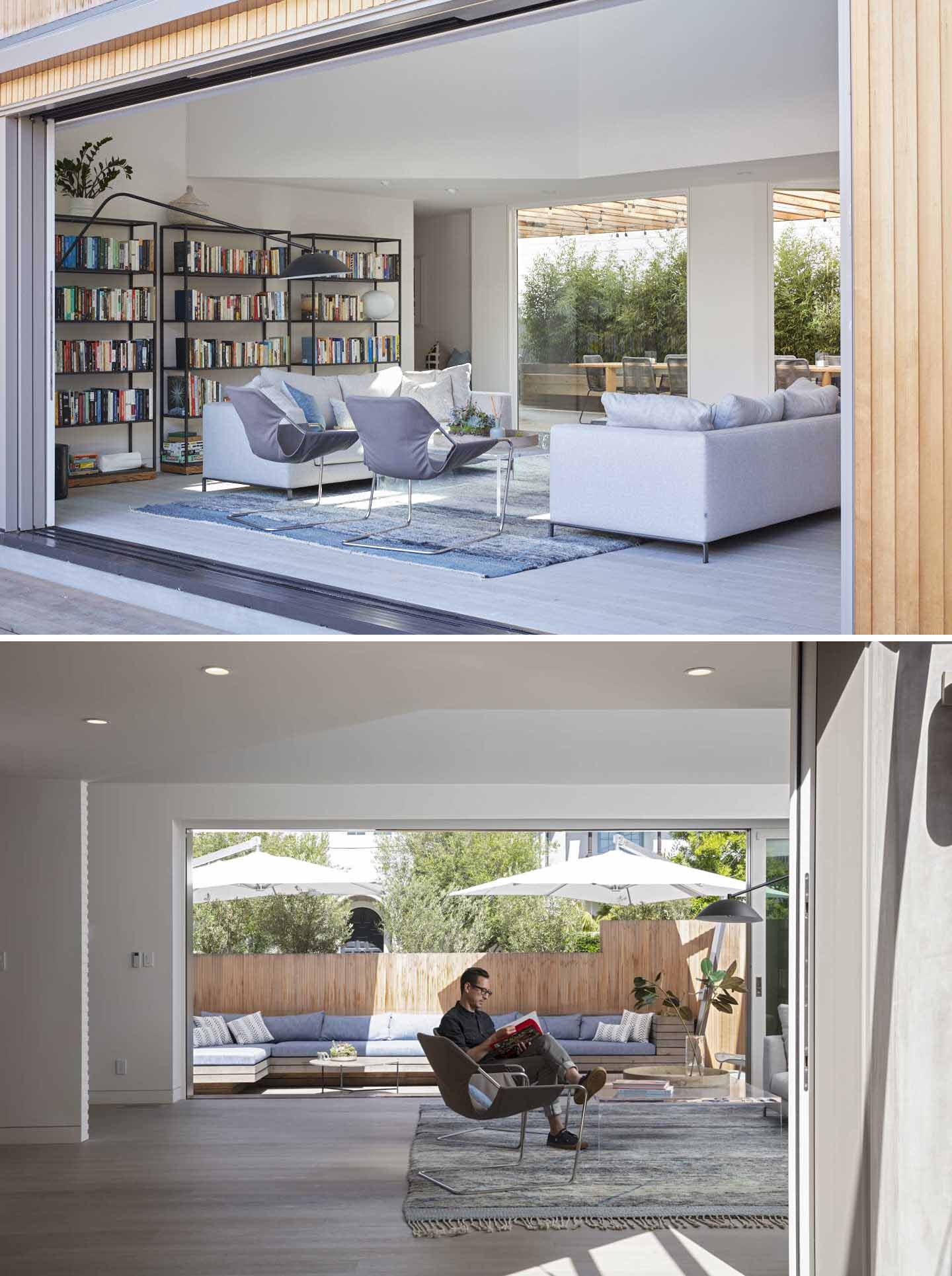 The living room has two large slider doors that invite ample light inside while connecting to outdoor spaces.