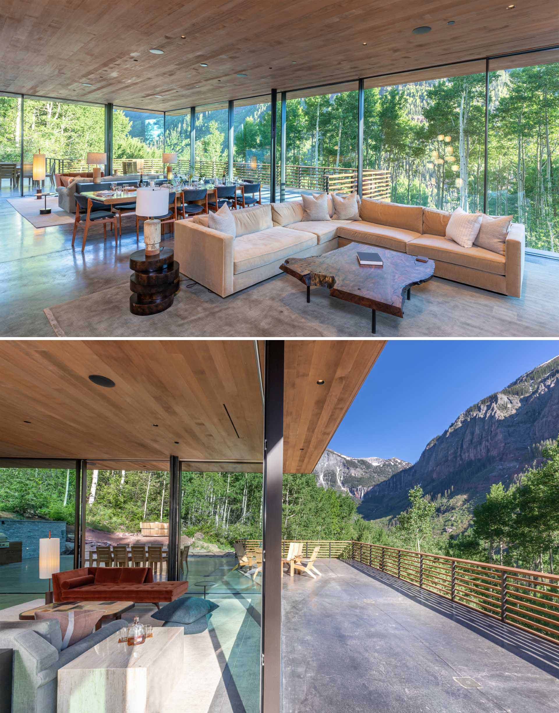 The open floor plan of this modern home contains the common spaces, including an open kitchen, an unobstructed, expansive living room, and an adjacent dining room.