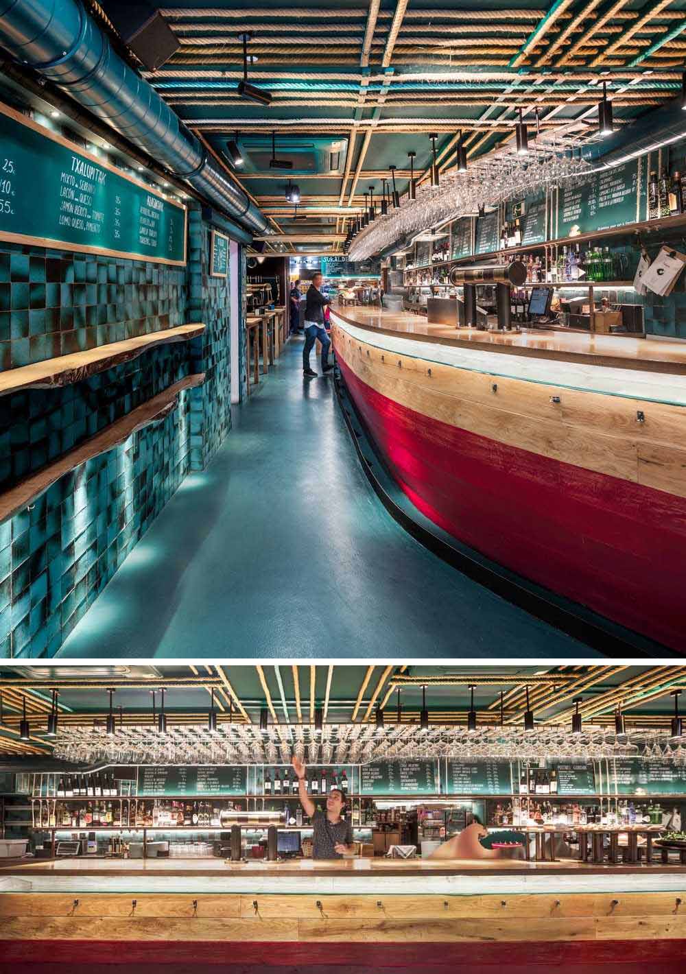 The name of the restaurant, Txalupa, is inspired by the name given to the fishing boats, while the curved wooden bar references the txalupas, both in its design, tones, and materiality.
