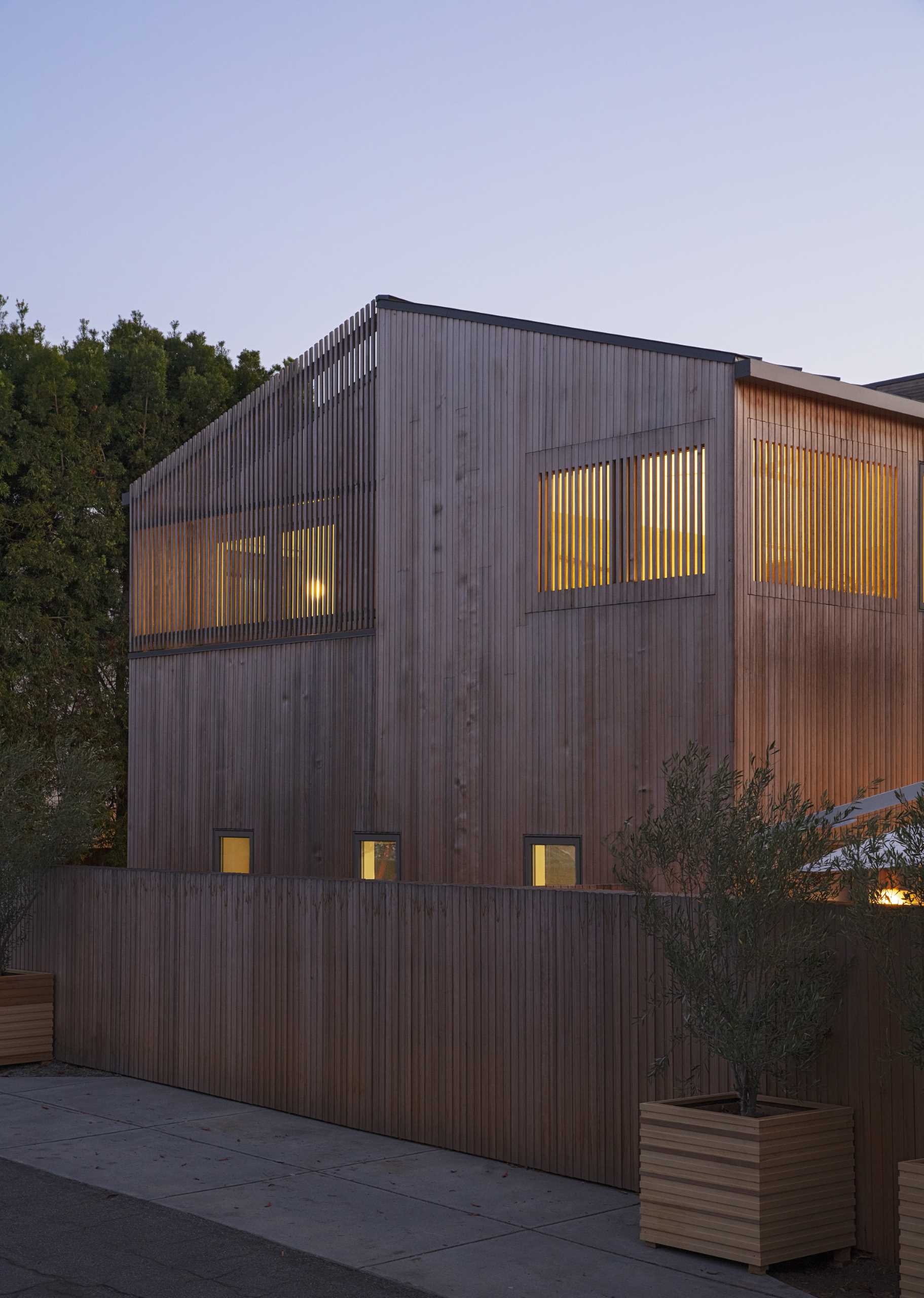The custom-milled siding of this modern house is Alaskan yellow cedar and was chosen specifically for how it will weather over time, graying out to create a rustic patina reminiscent of the Sea Ranch aesthetic.