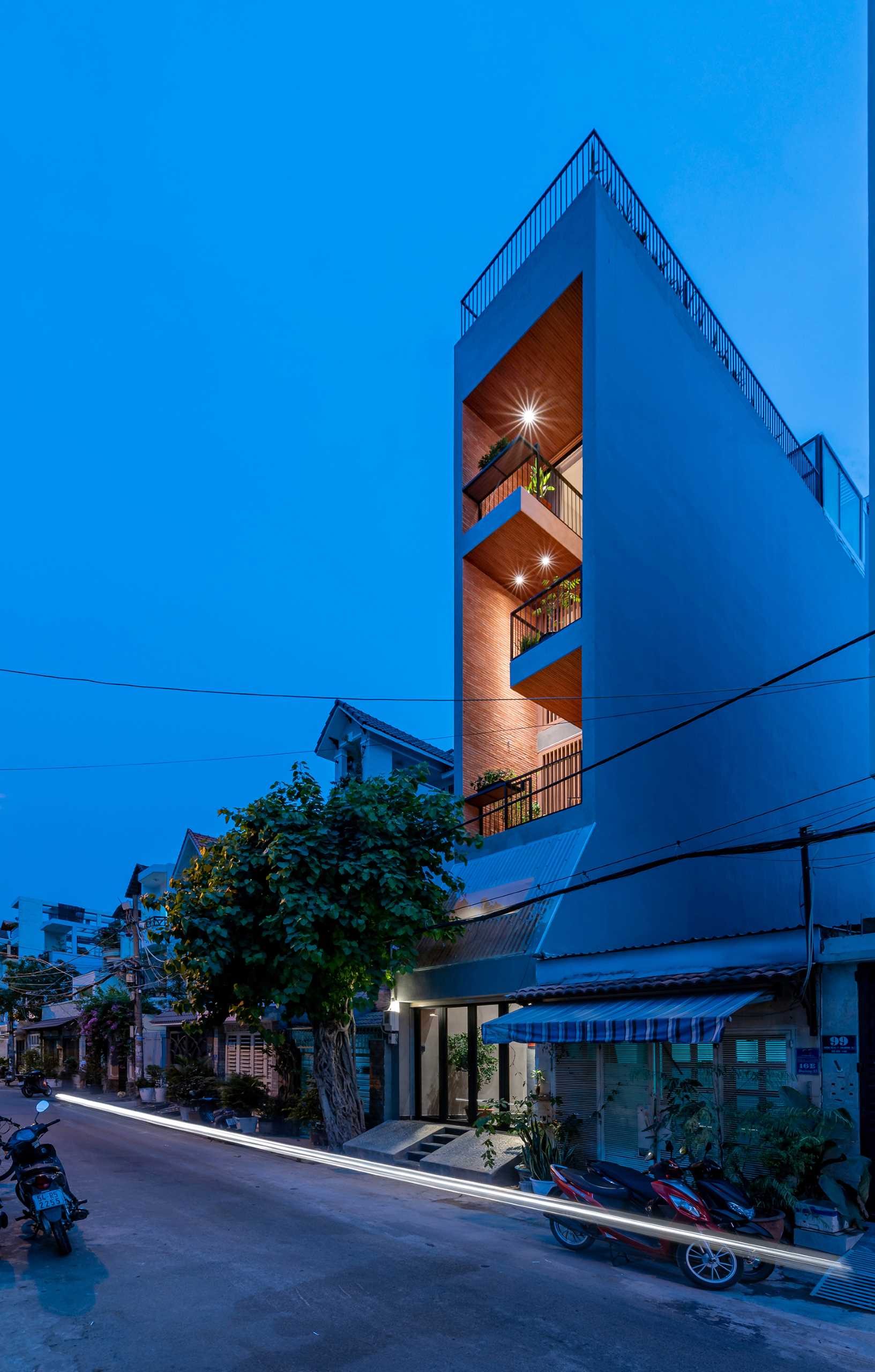 A tall and skinny house with six levels, including a rooftop pool.