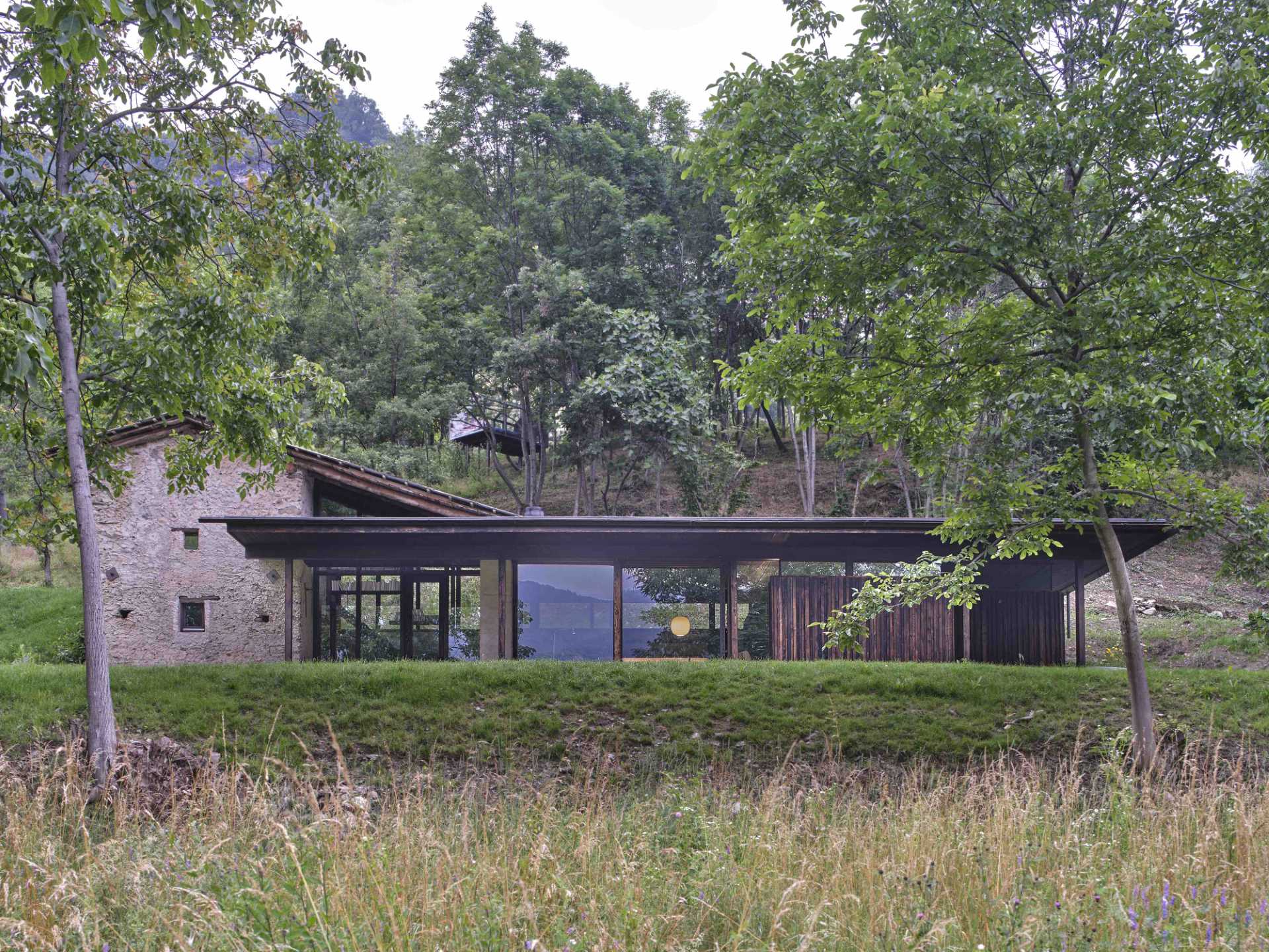 An abandoned stone ruin that was once overgrown with brambles, has been transformed into a small off-grid home.