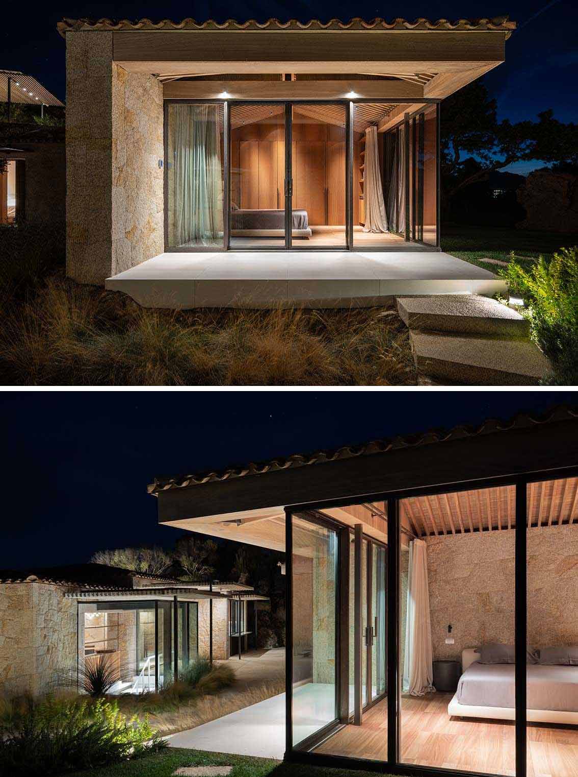 Here's a look at the home at nighttime with exterior lights highlighting the stone and design of the house.