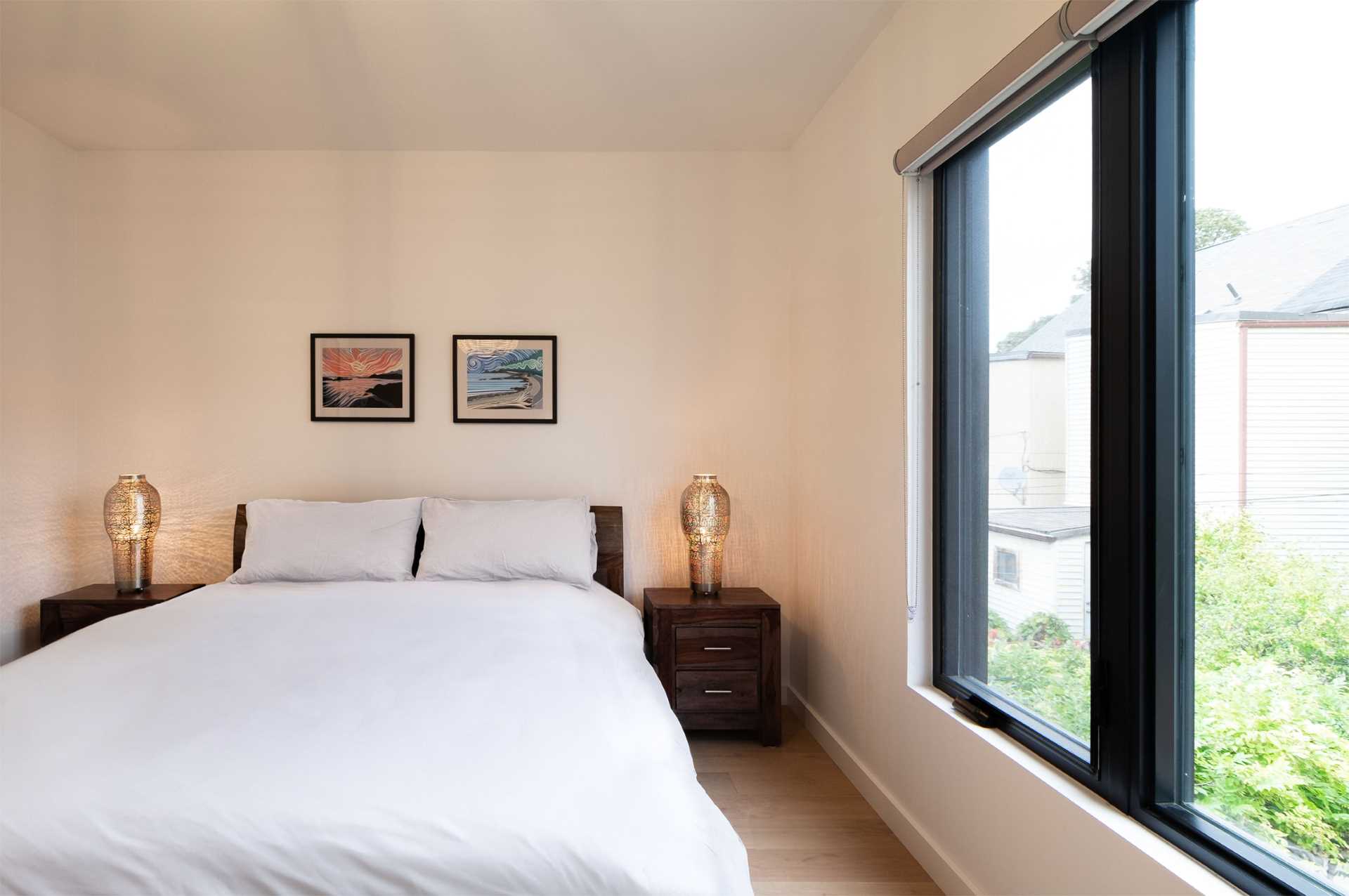 A bedroom with a neutral color palette.