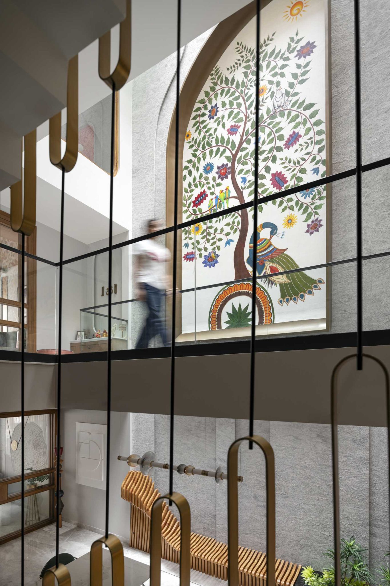 A Large Mural Adds Color To The Interior Of This Narrow Home