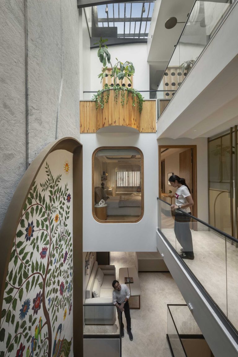 A Large Mural Adds Color To The Interior Of This Narrow Home