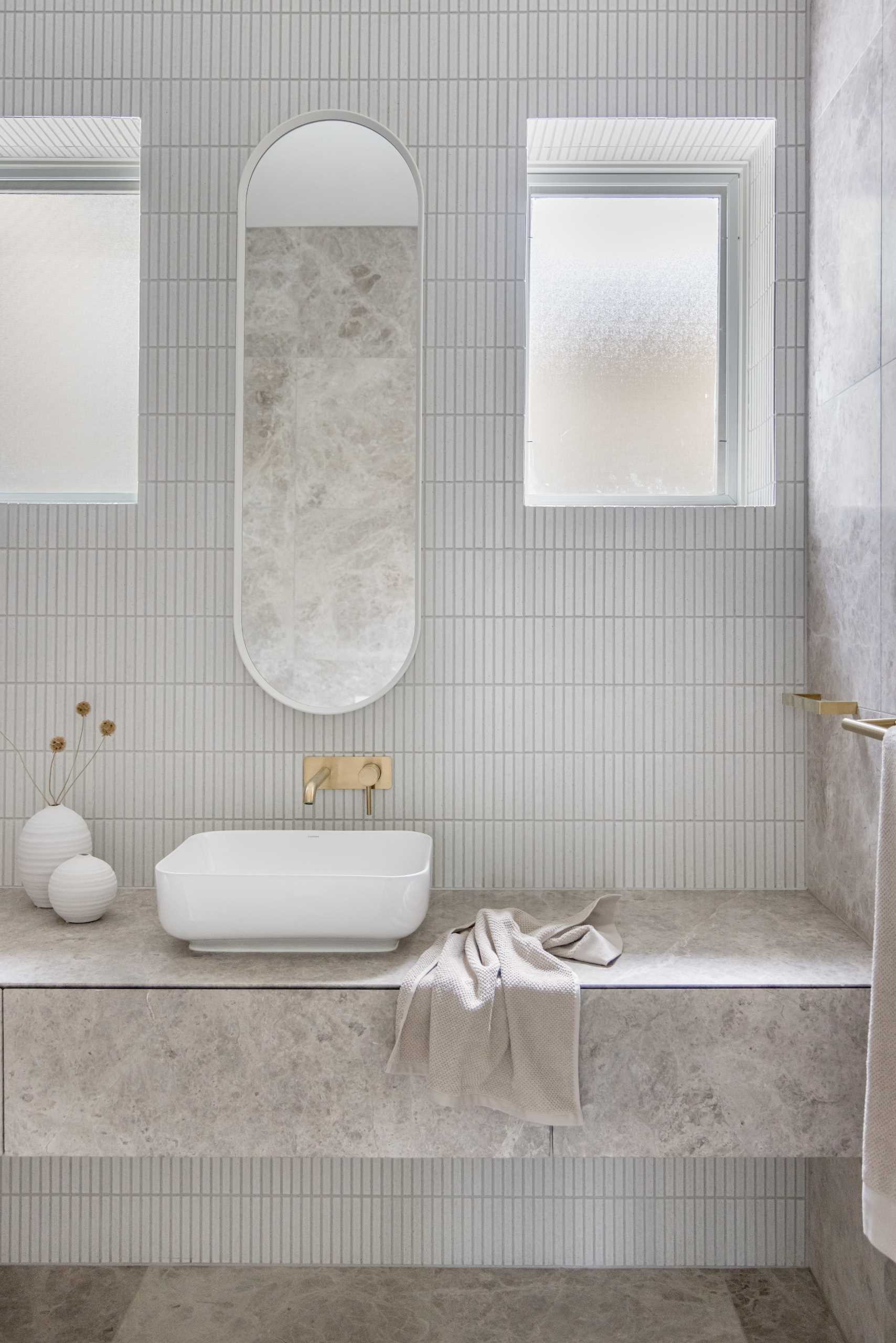 A modern bathroom with a neutral colour palette.