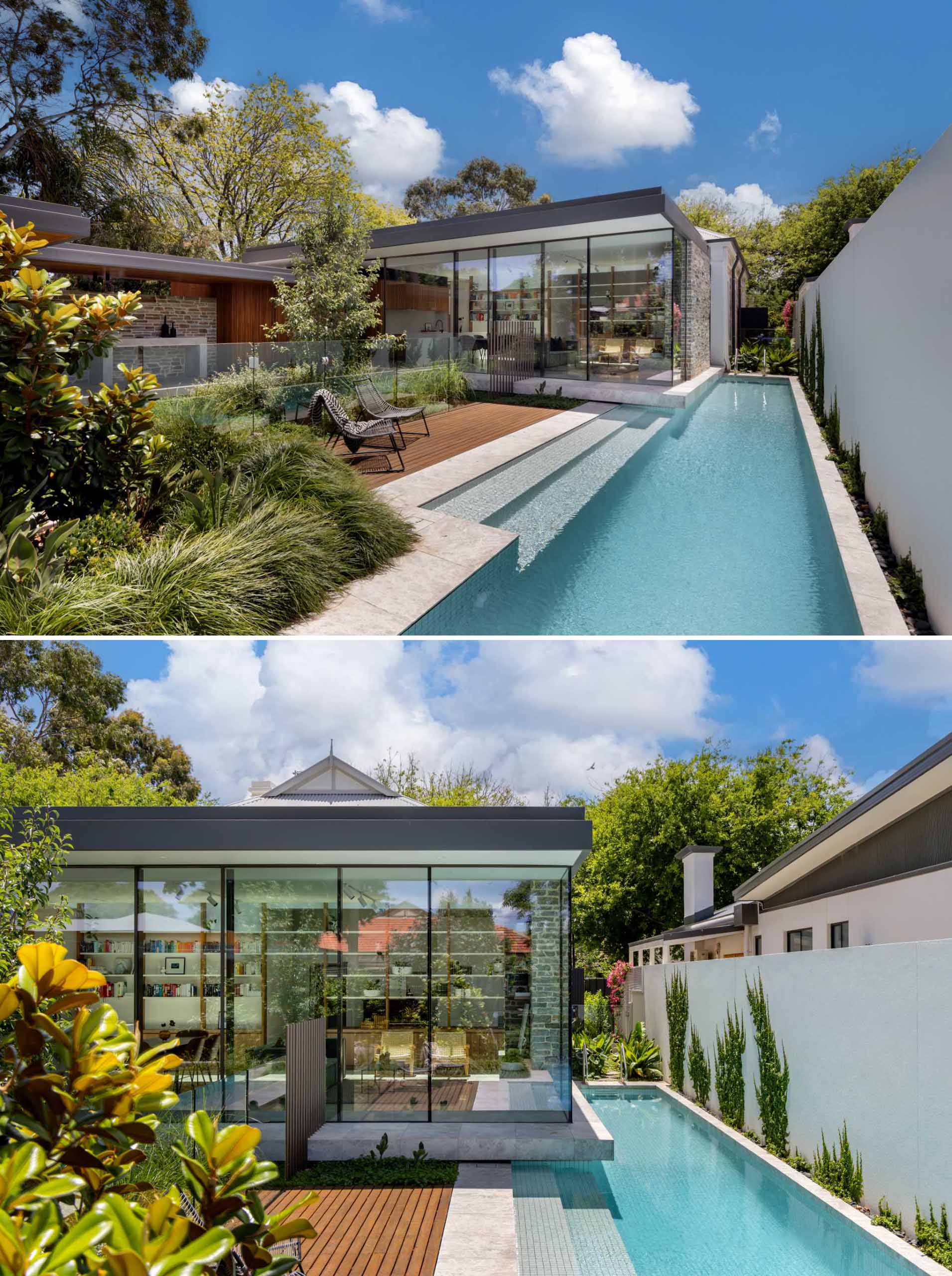 A structured floating box with glass walls has a nearby sunken garden, a patio, and a rectangular pool.
