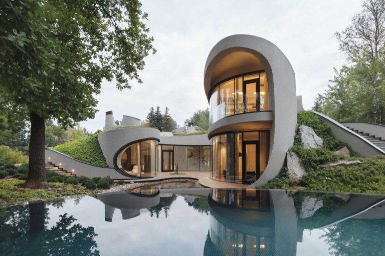 This Sculptural Home Is Full Of Curves And Surrounded By Landscaping