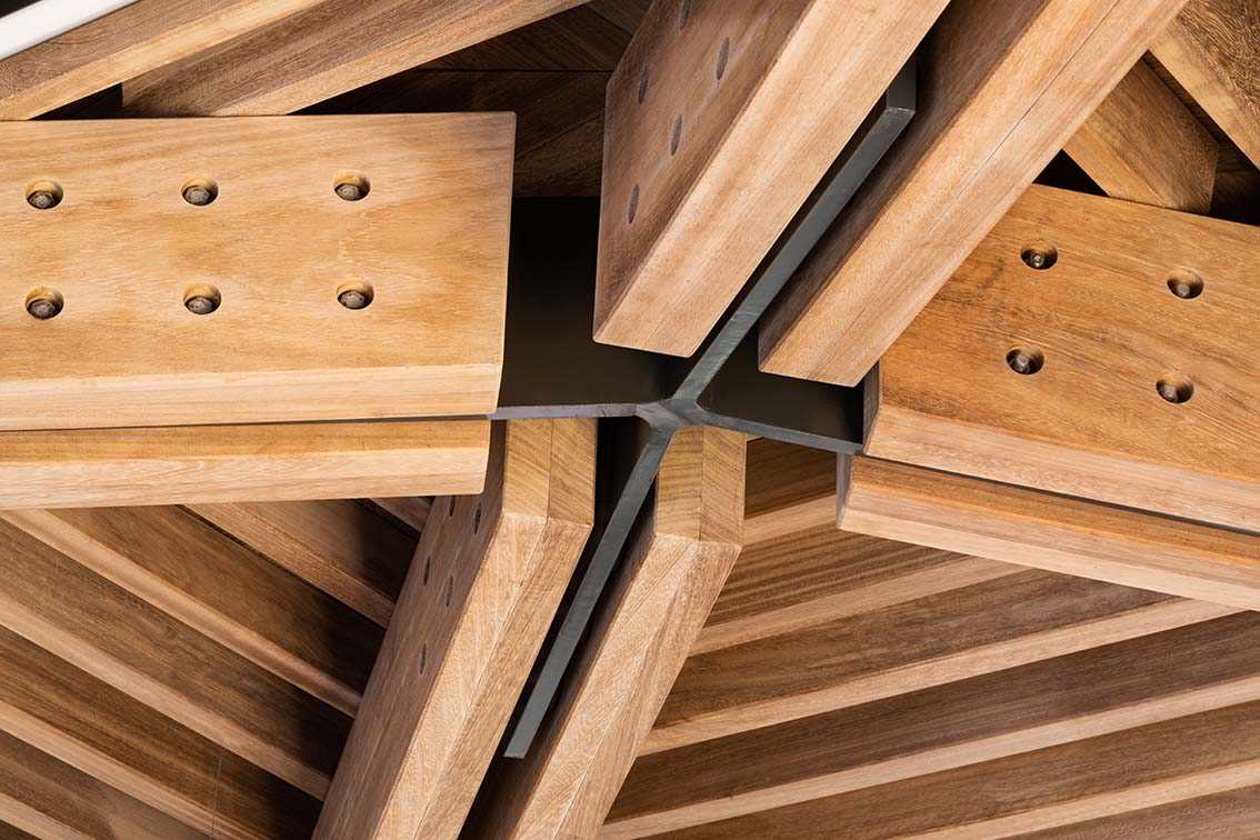Ceiling detail where wood beams meet.