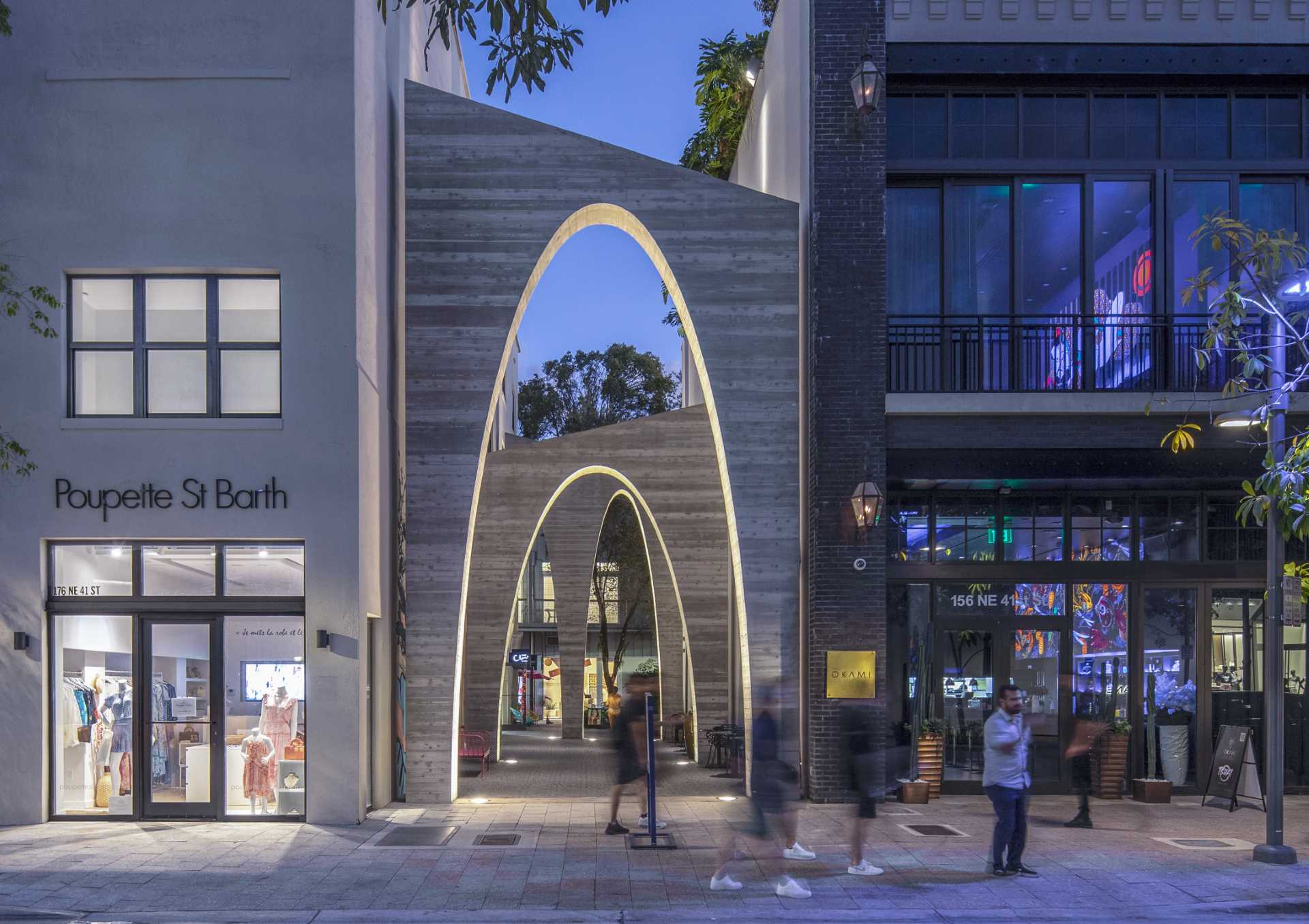 A series of arches were added to a nondescript alley to create an art installation that added life to the area.