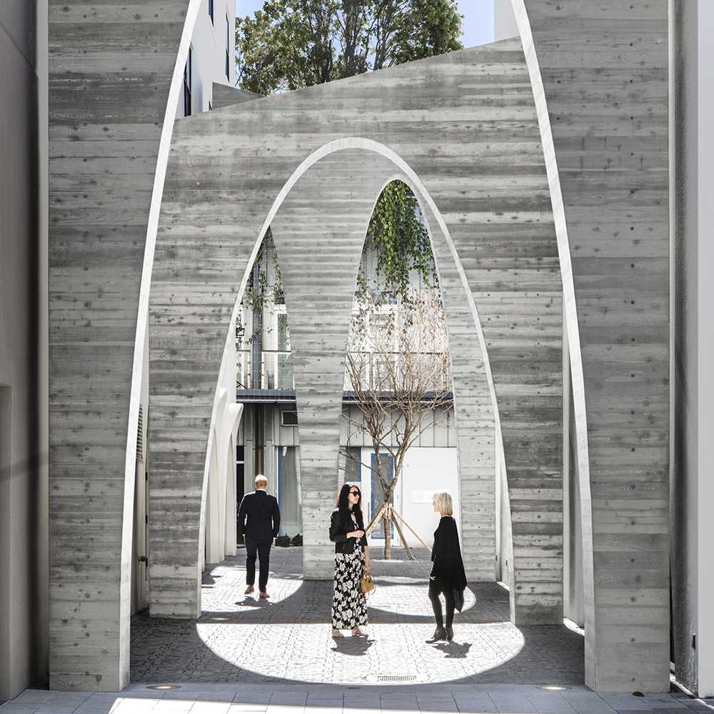 A series of arches were added to a nondescript alley to create an art installation that added life to the area.