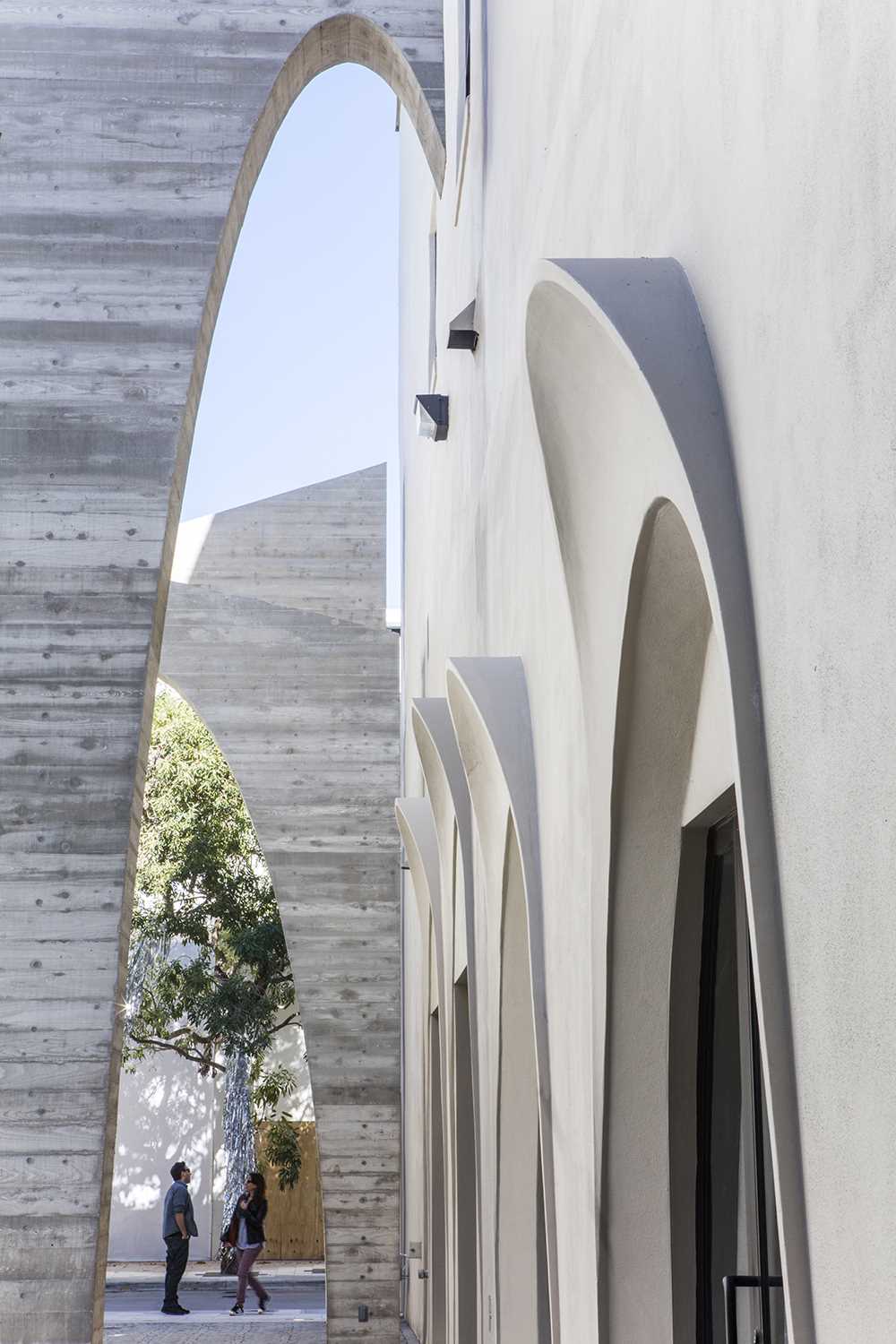 A series of arches were added to a nondescript alley to create an art installation that added life to the area.