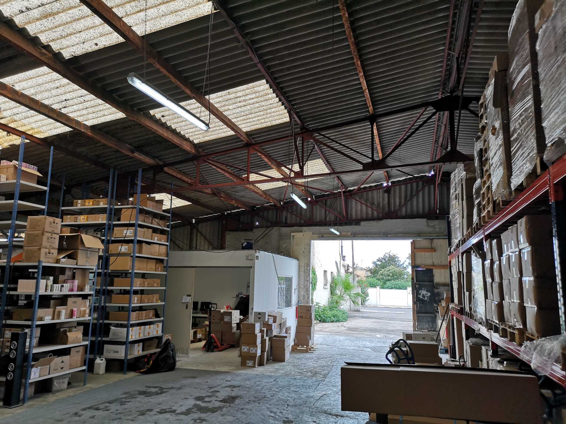 BEFORE Photo - This warehouse was converted into a modern industrial-inspired home with walls of glass.
