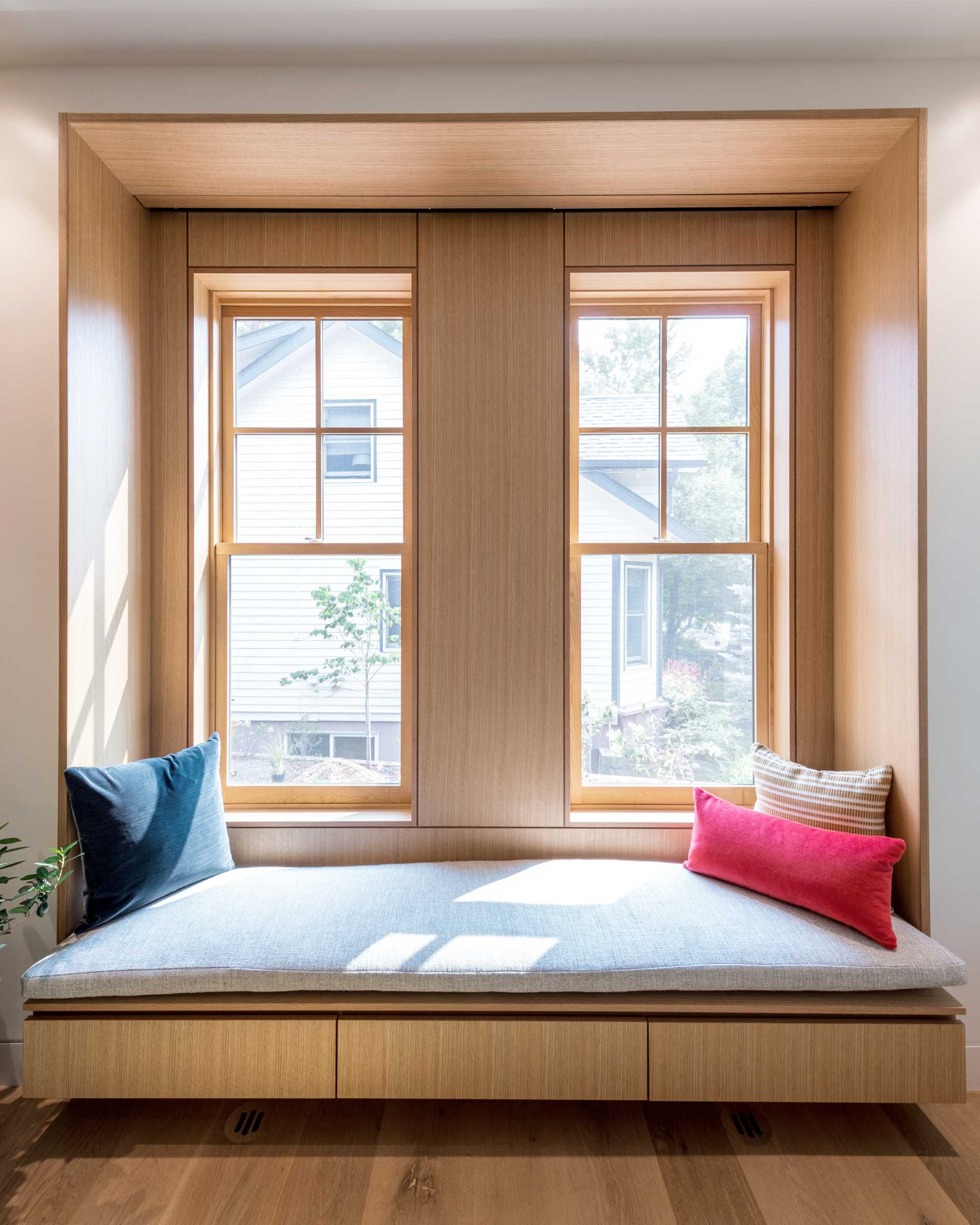 A modern wood-lined window seat.