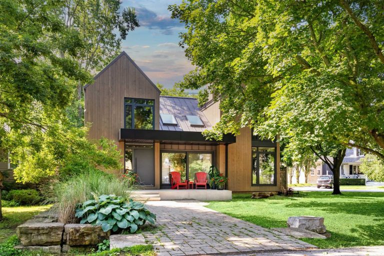 Extensive Hanging Plants Soften The Use Of Concrete In This Homes Design