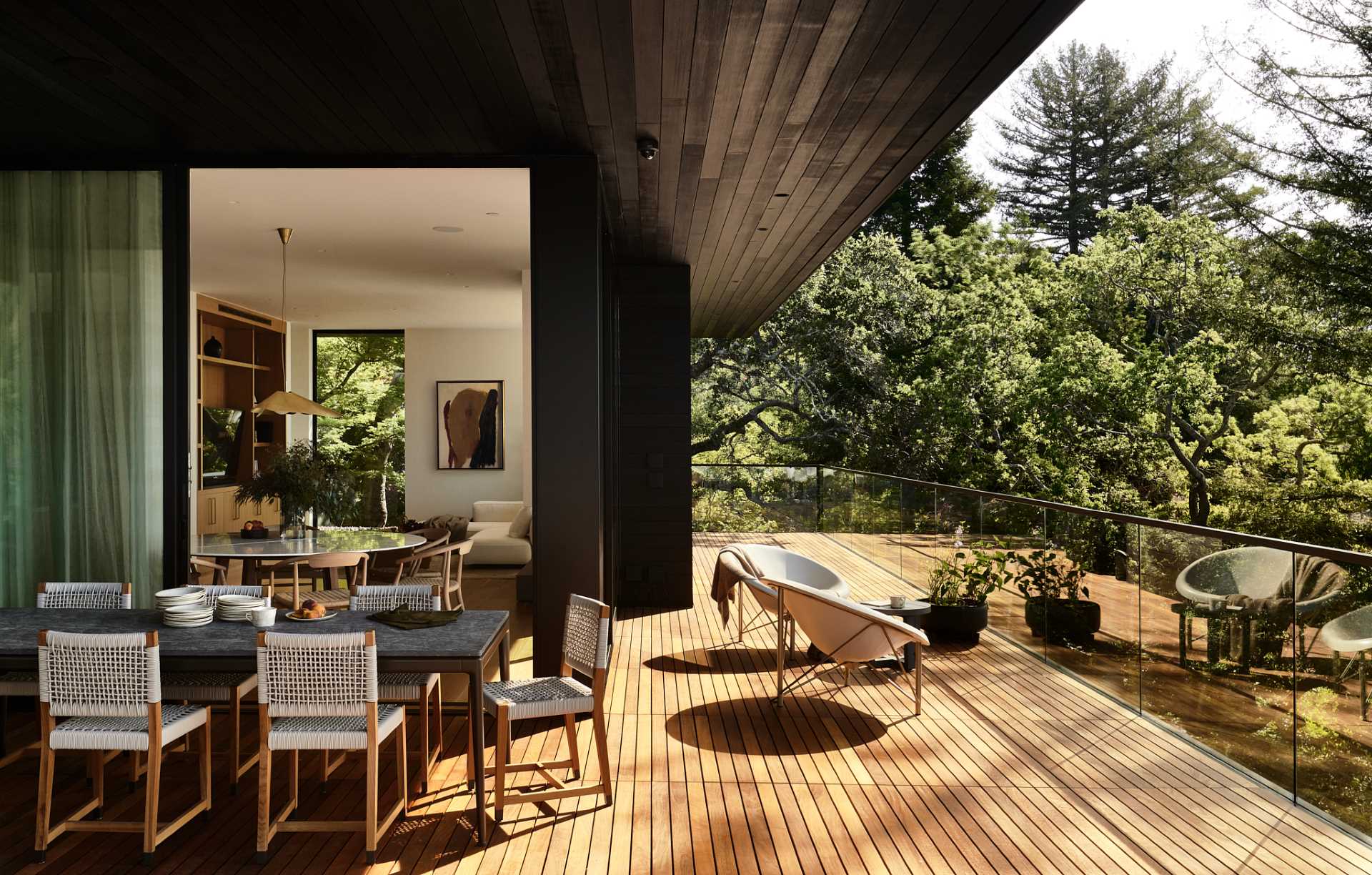 A casual dining area is positioned by sliding glass doors that open to the balcony.