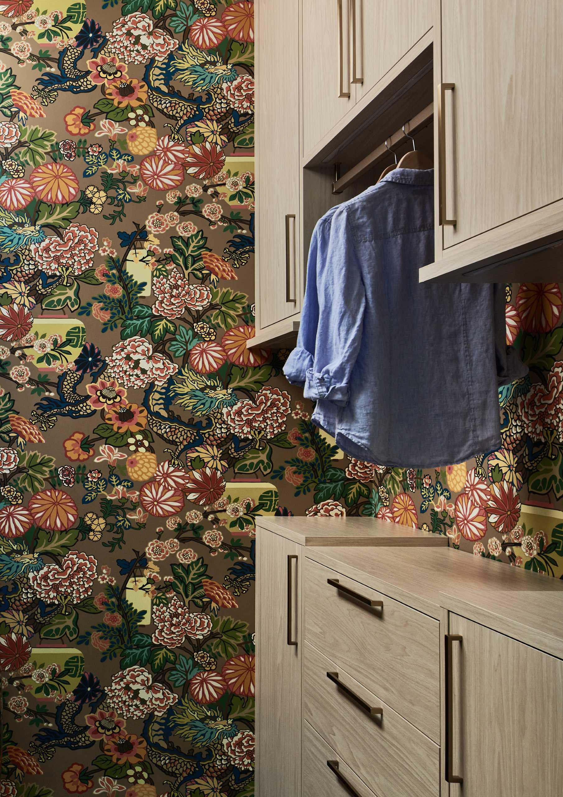 A colorful wallpaper print livens up this laundry room.