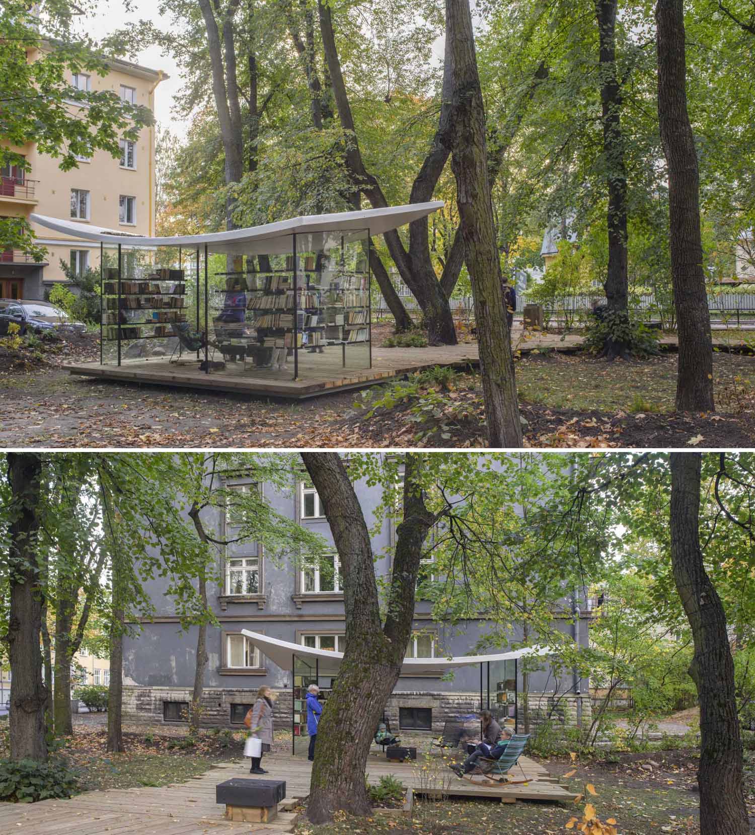 A small public library with glass walls and a white roof that's inspired by a sheet of paper.