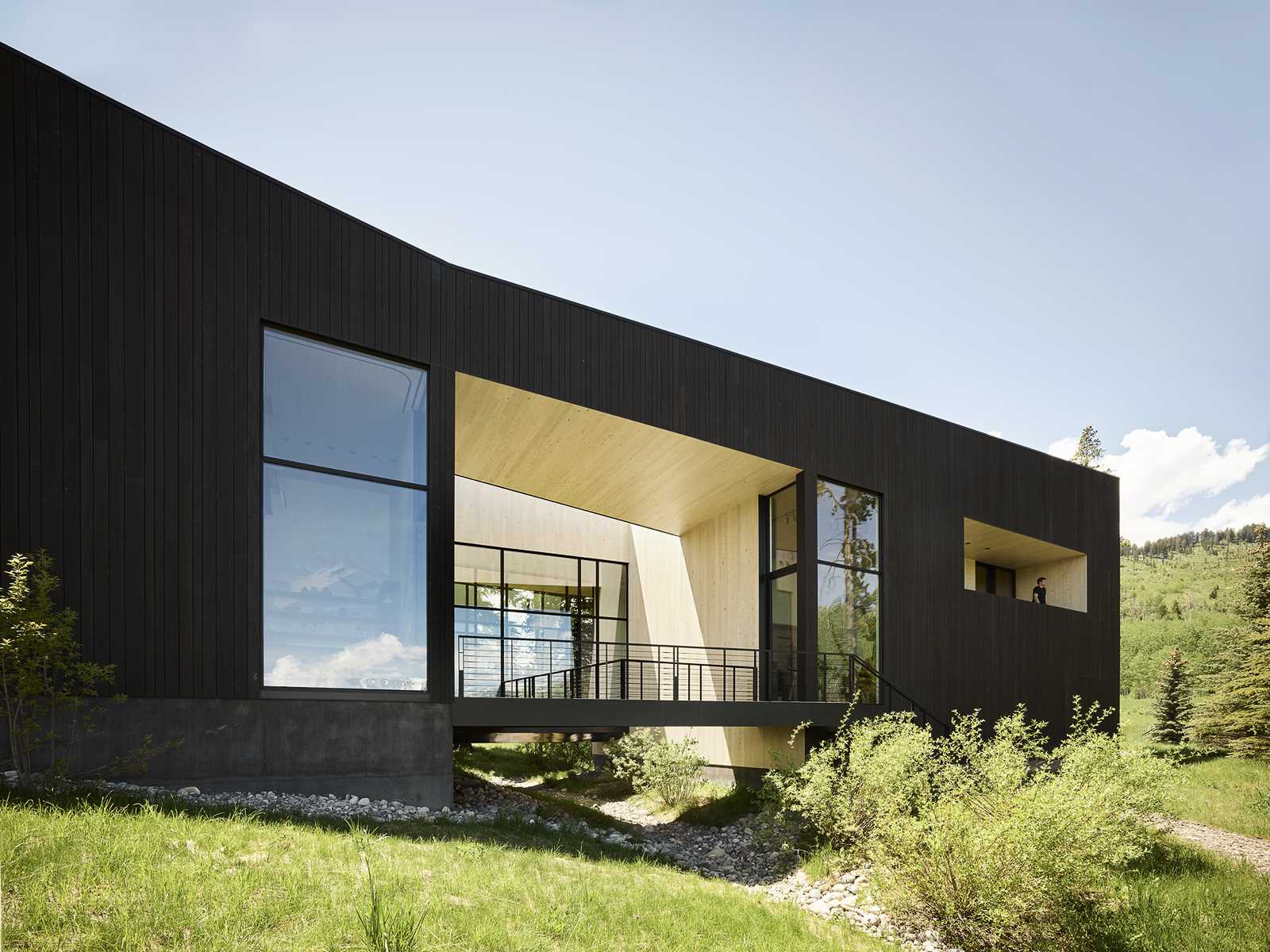 A modern home features a charred shou sugi ban exterior.