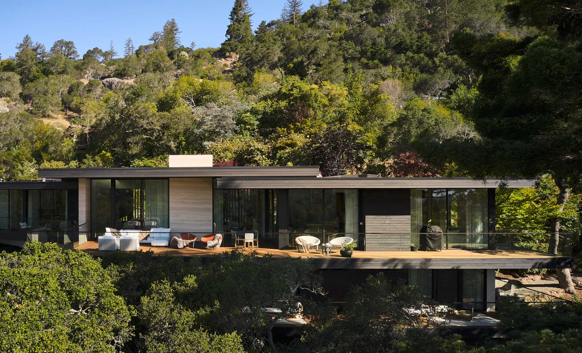 An updated home includes materials like wood boards and travertine slabs.