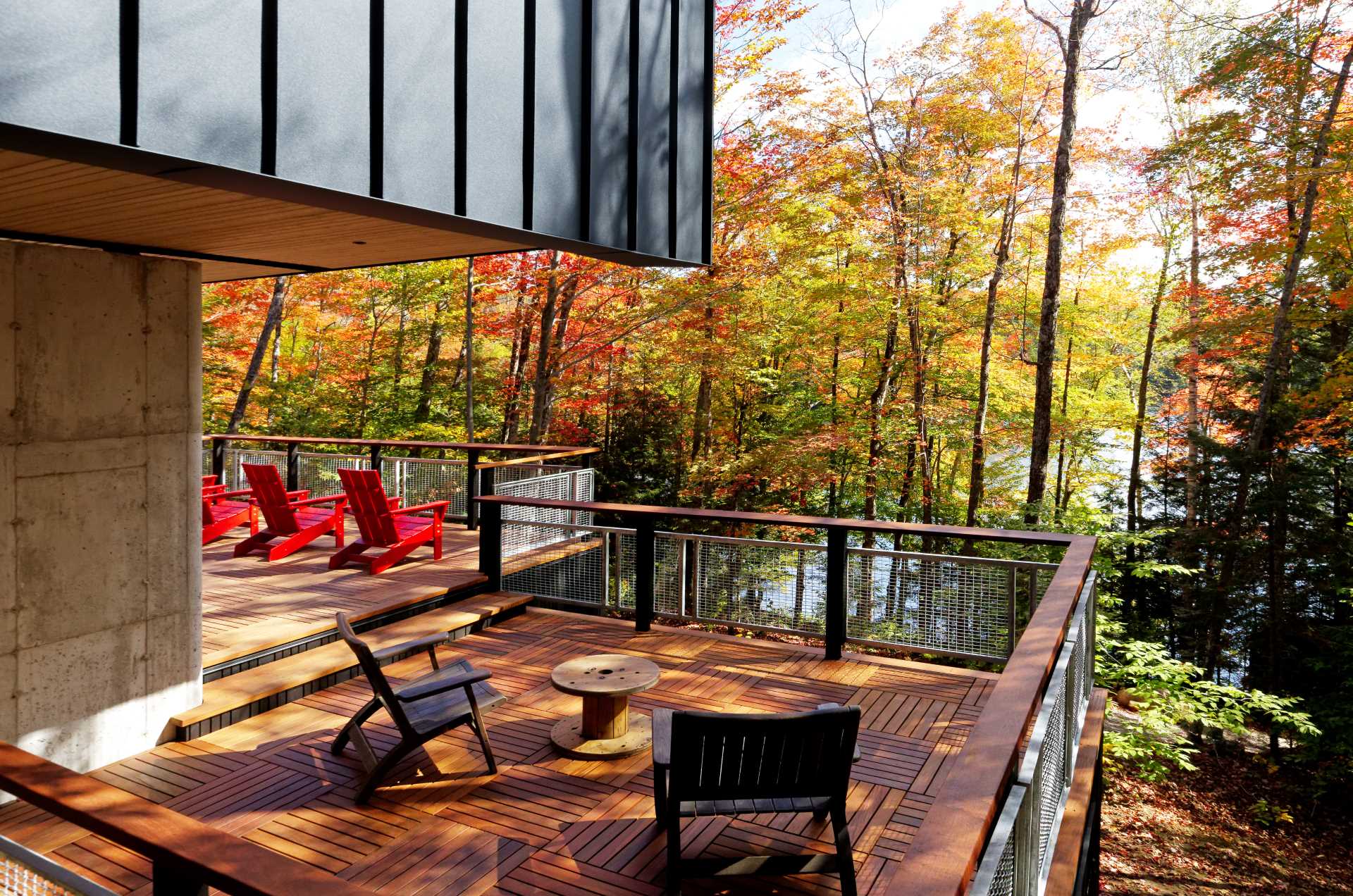 A modern lakehouse with outdoor spaces that extend the living areas.