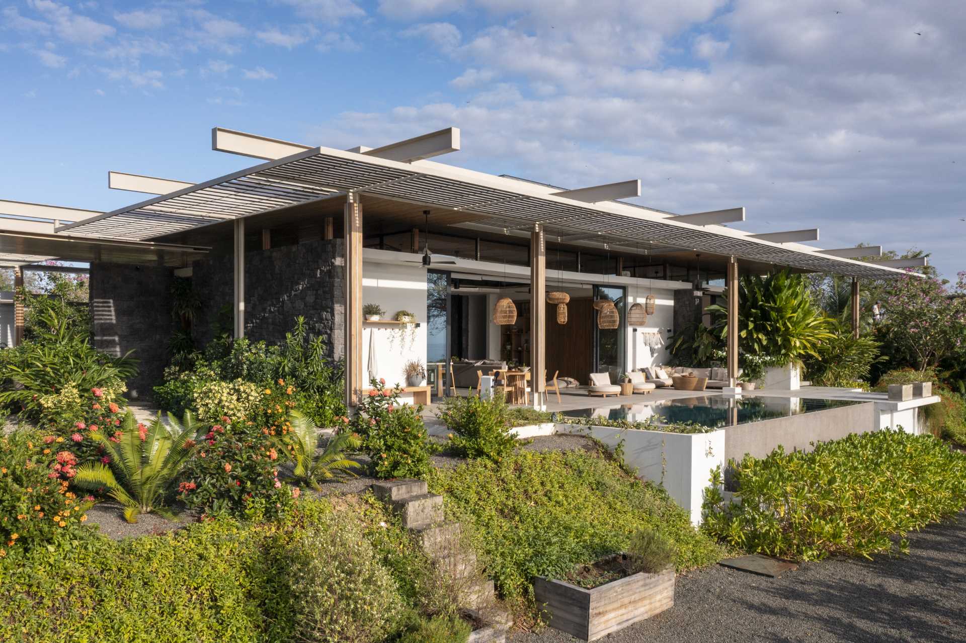 A modern home with a series of pergolas.