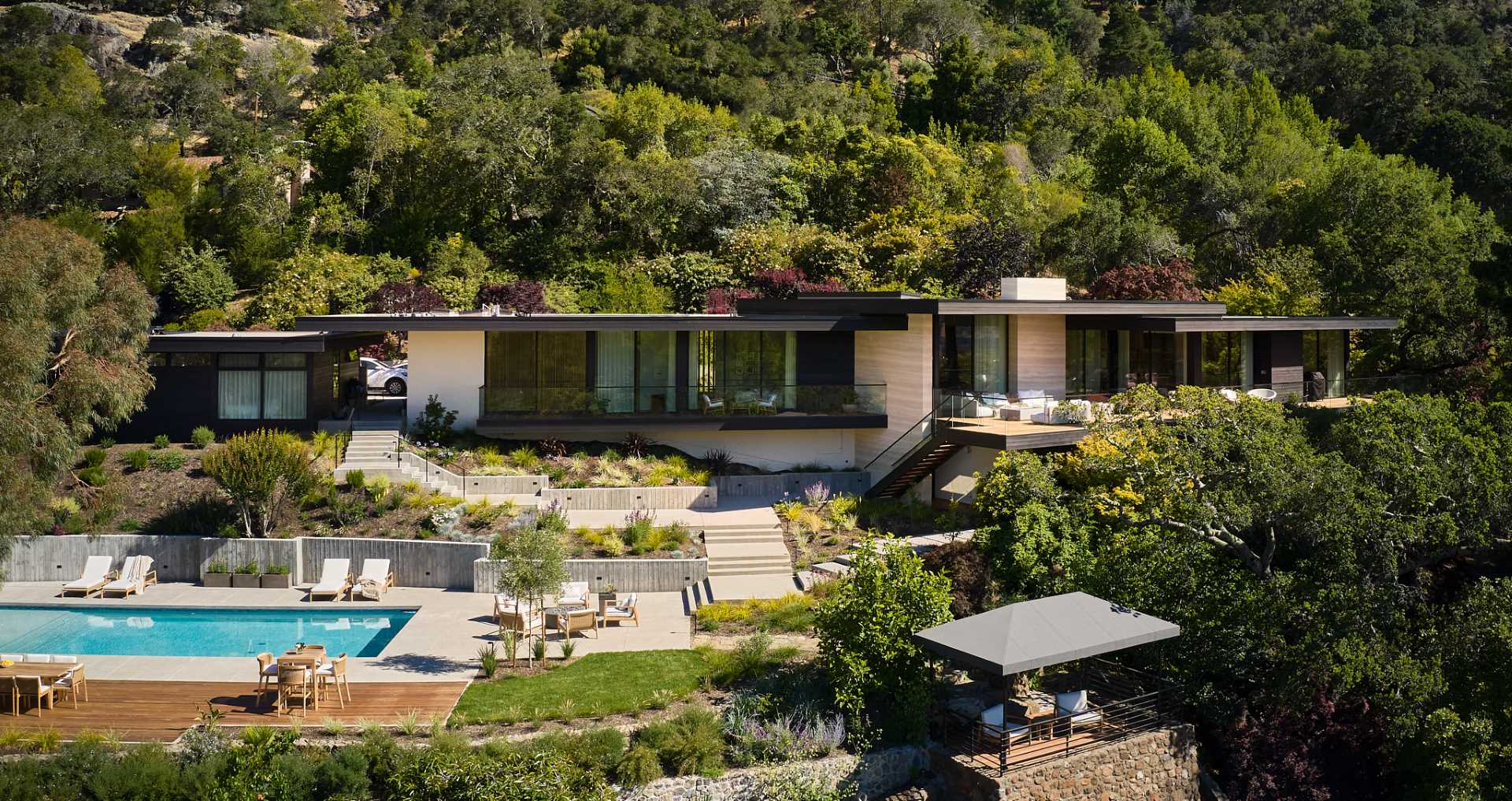 An updated home includes materials like wood boards and travertine slabs.