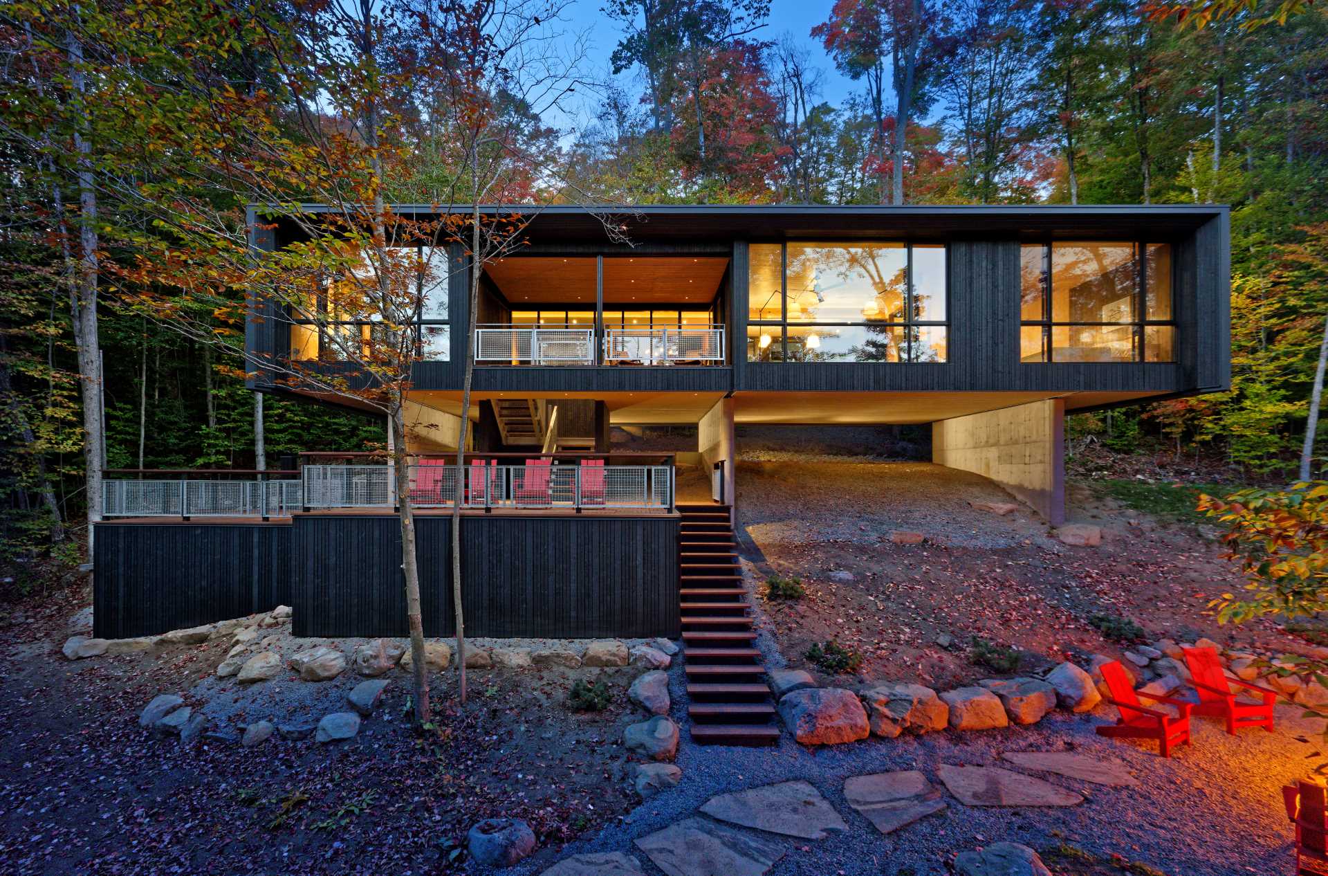 A contemporary lakehome that hovers above the natural sloped terrain close to the water’s edge of Kawagama Lake.