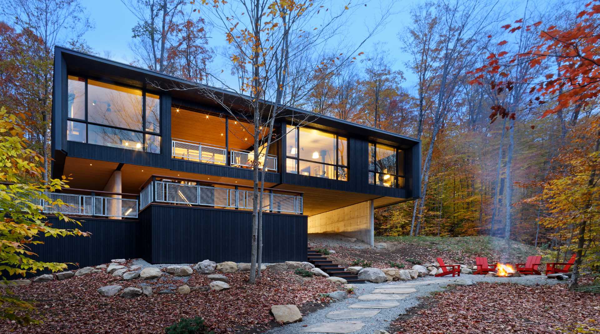 A contemporary lakehome that hovers above the natural sloped terrain close to the water’s edge of Kawagama Lake.