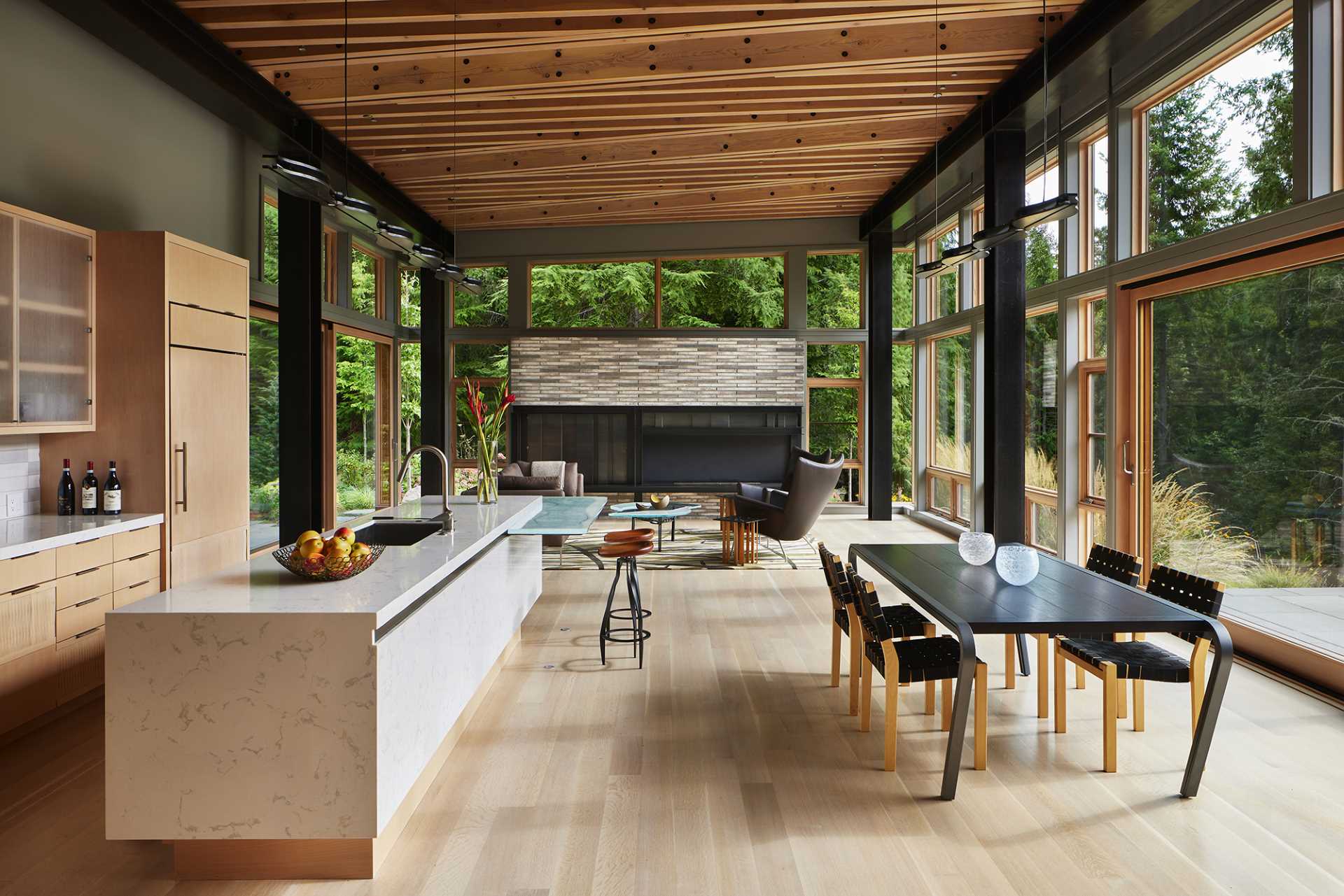 A contemporary great room with a dense pattern of exposed wood beams.