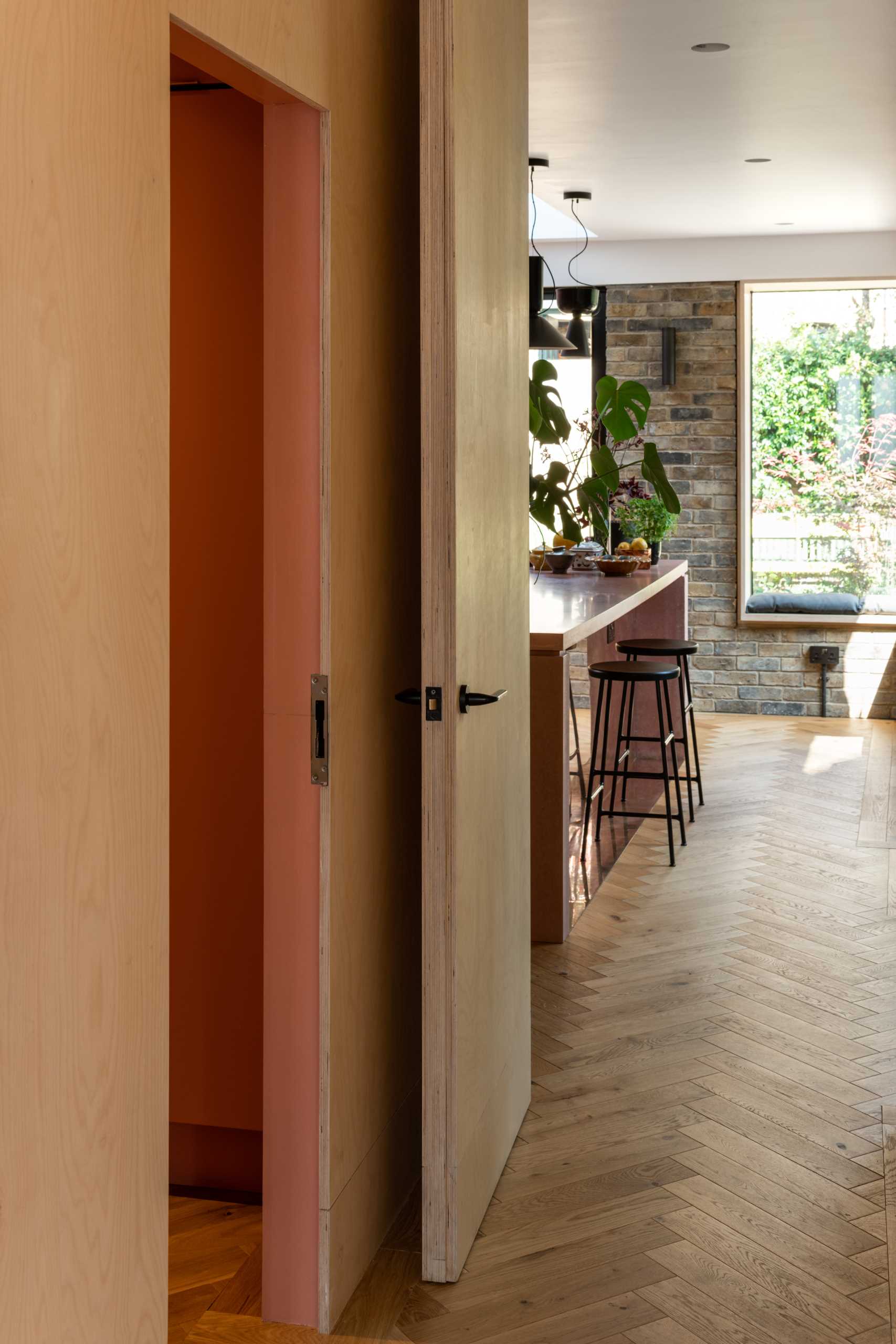 A wood box includes storage and a powder room.