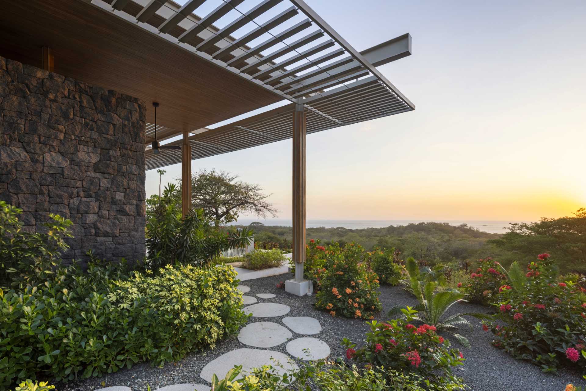 Stepping stone paths lead to the various entryways of this modern home.