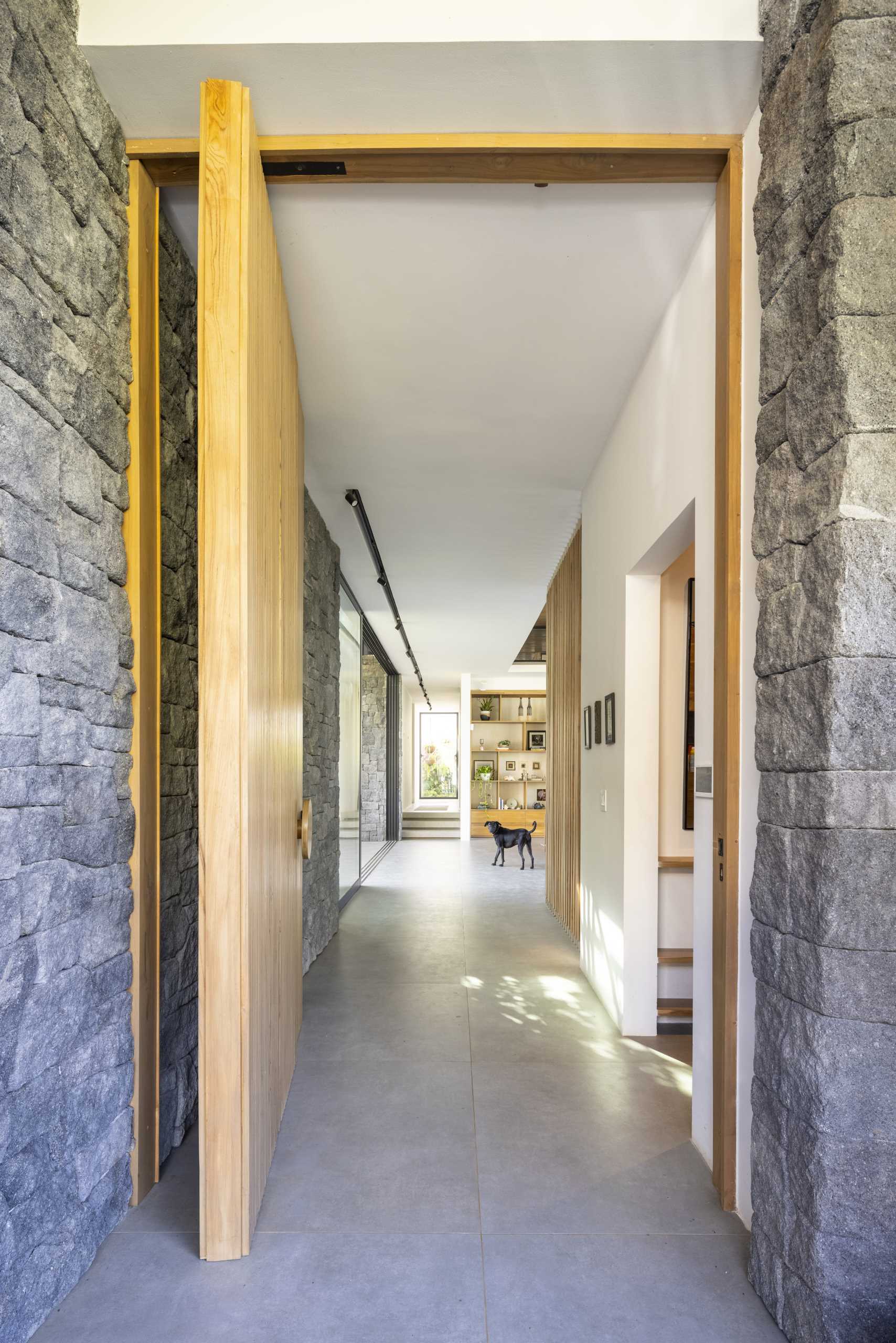 Stepping stone paths lead to the various entryways of this modern home.
