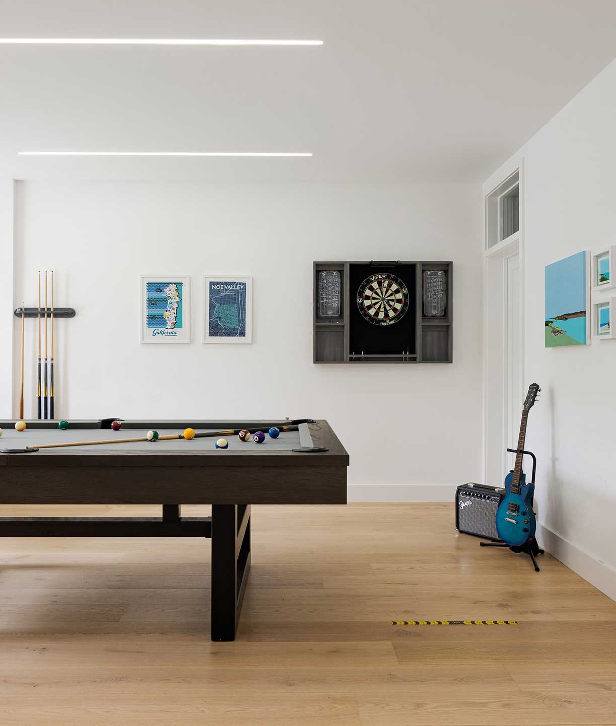 The basement of this renovated home which opens to the garden ,is used for games and as a gym.
