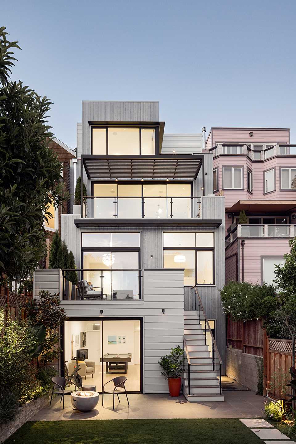 A strategically added full basement below the garage level was the solution that created a valuable stepout access to the rear garden, which previously was seldom used.