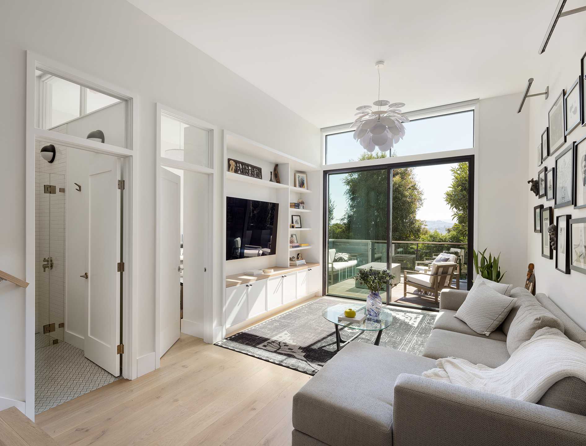 A modern living room with built-in TV wall.