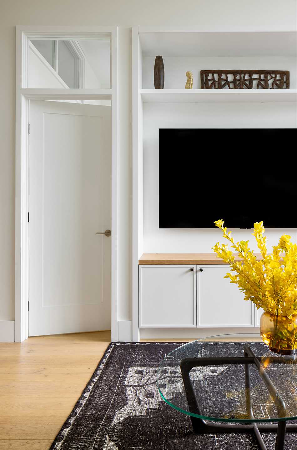 A modern living room with built-in TV wall.