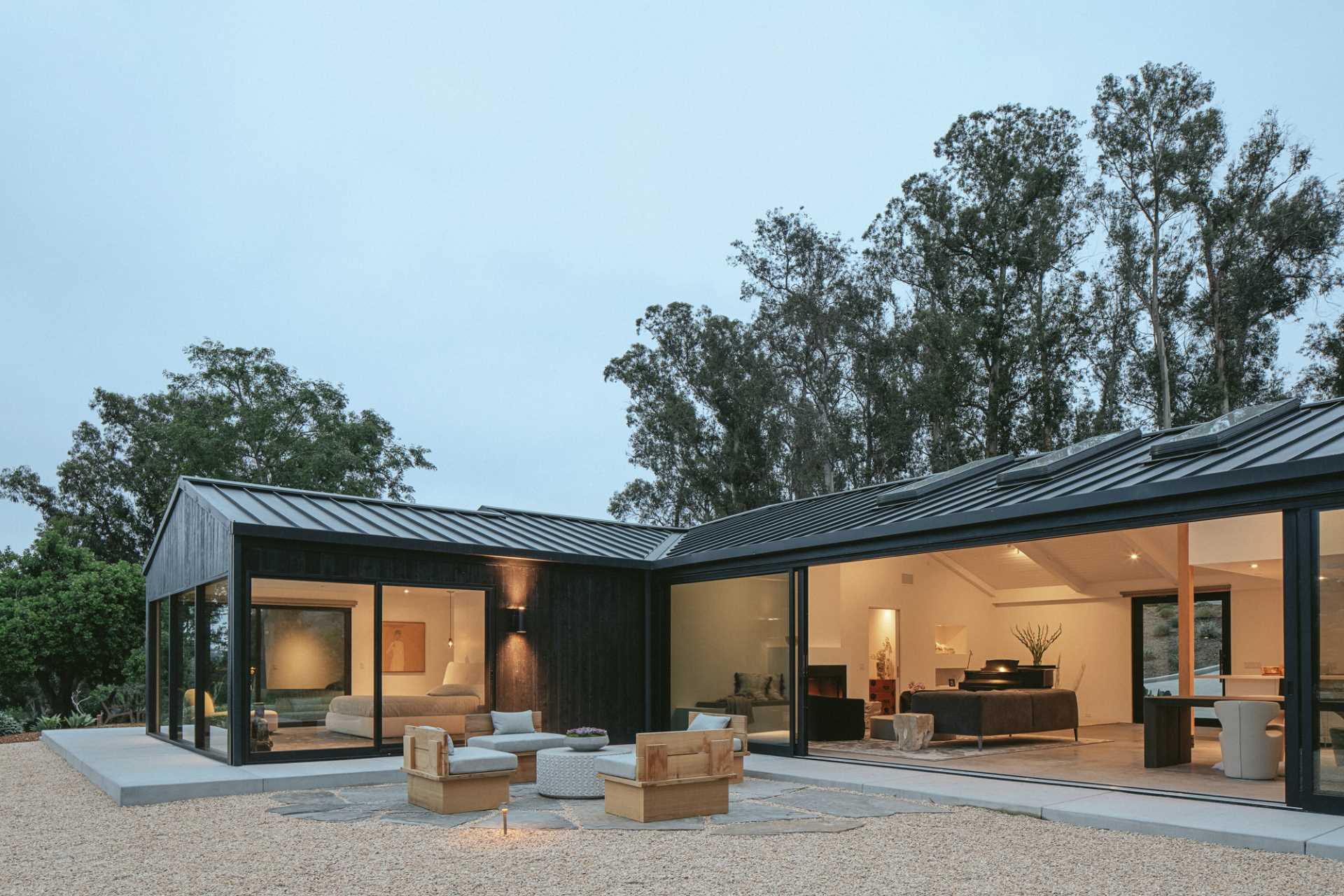 Existing board-and-batten wood siding on this renovated home was replaced with new charred shou sugi ban cedar cladding.