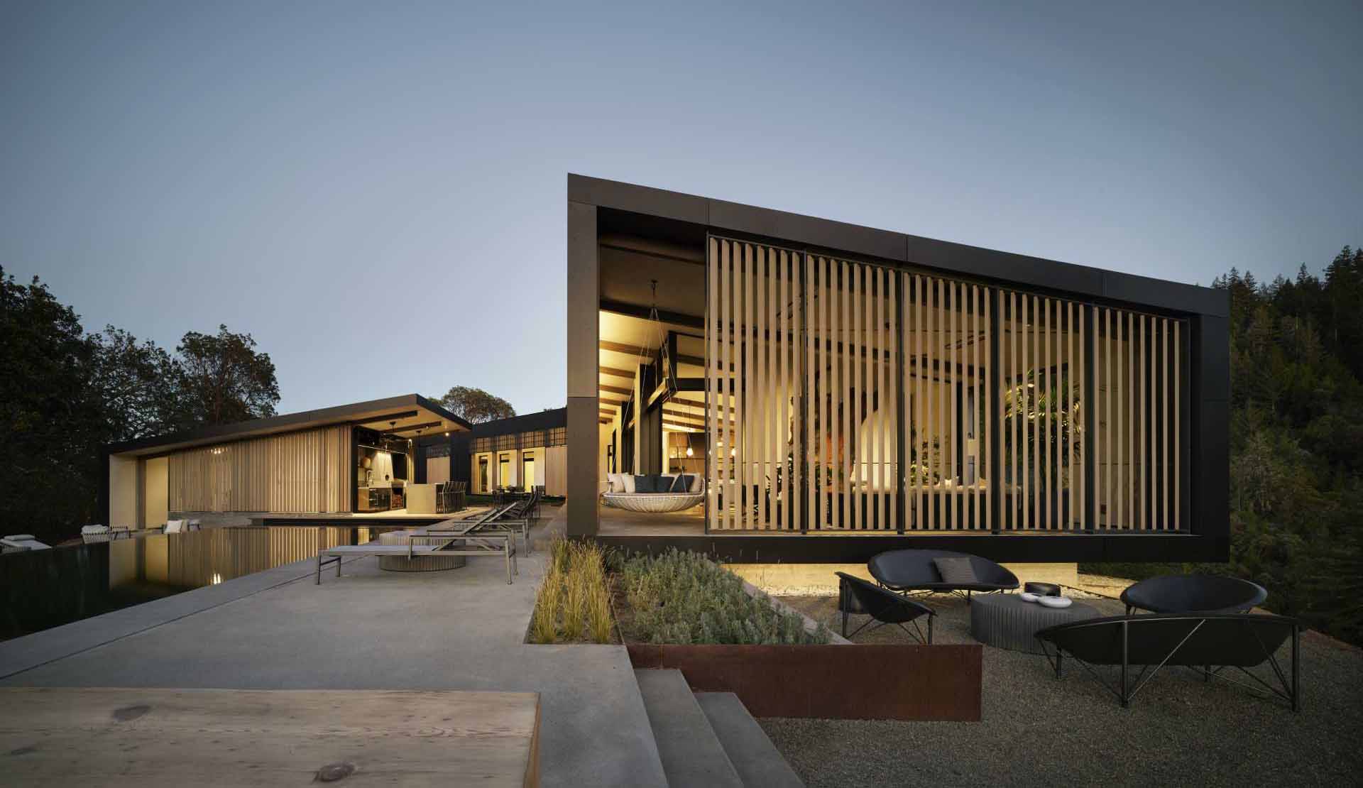 A modern home with a pitched ceiling and exposed wood beams.