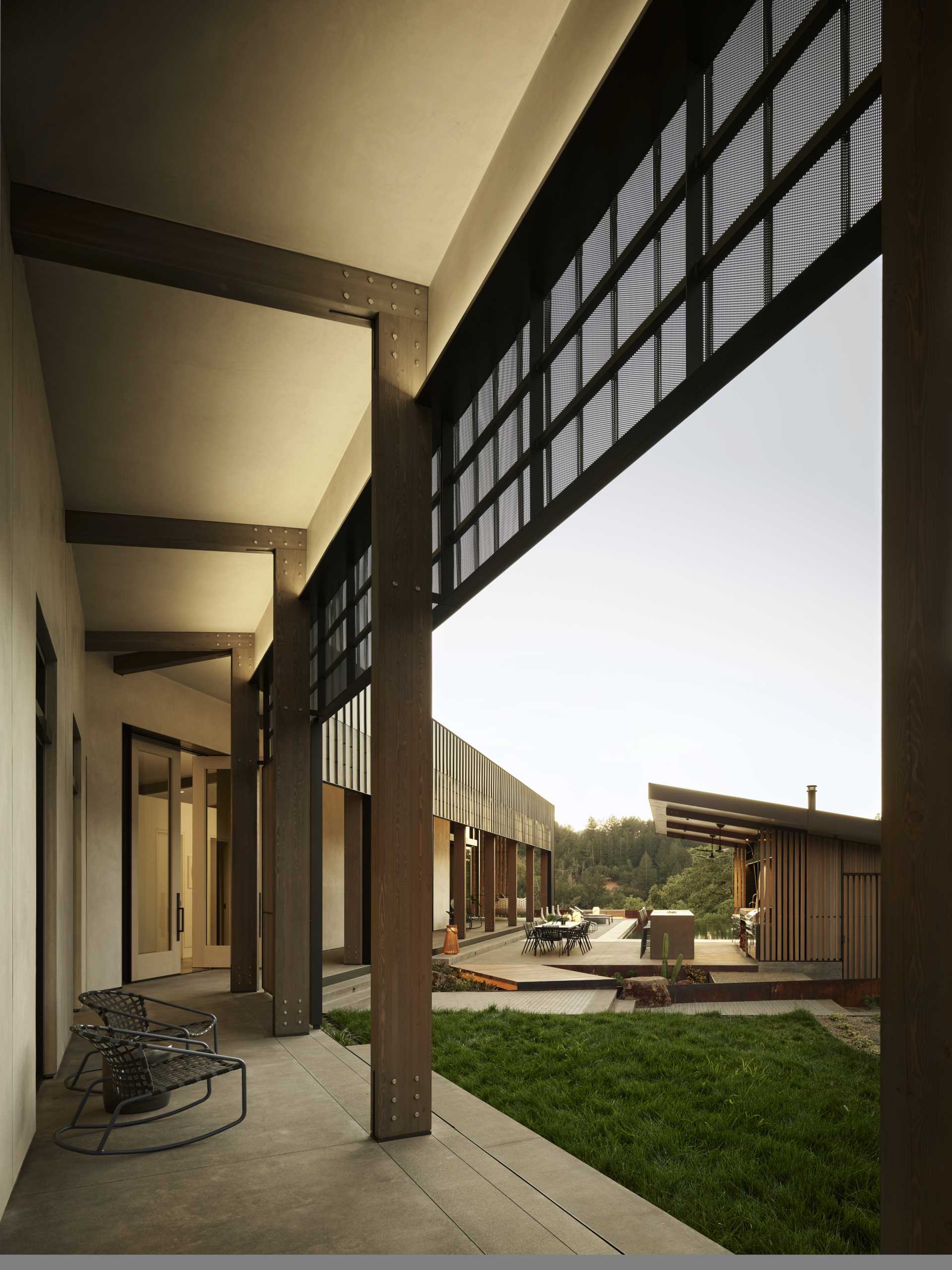 A modern home with a pitched ceiling and exposed wood beams.