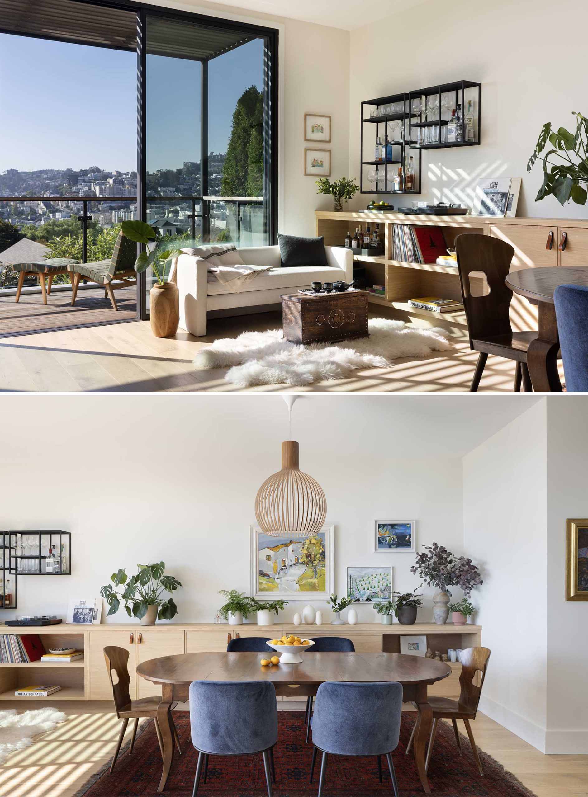 The interior of this renovated home, which is bathed in natural light, is contemporary and includes some built-in designs, like a wall-to-wall storage unit in the dining area.