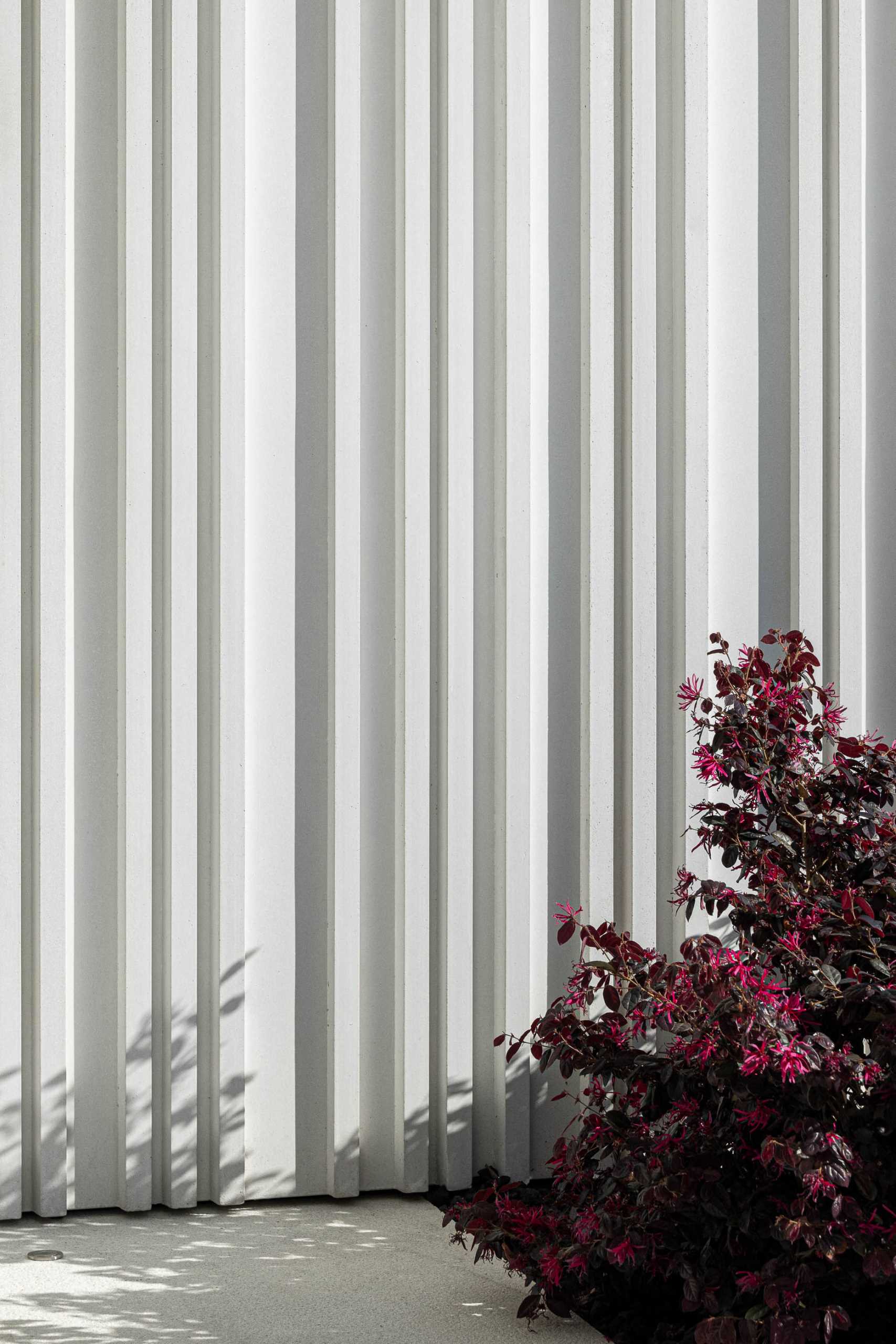 Here's a close-up look at the vertical stripes that cover sections of this modern home, while the depth of the lines is highlighted by the shadows.