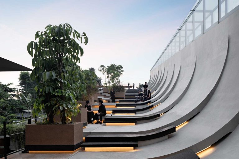 This Building With A Split Roof Makes Space For A Rooftop Park