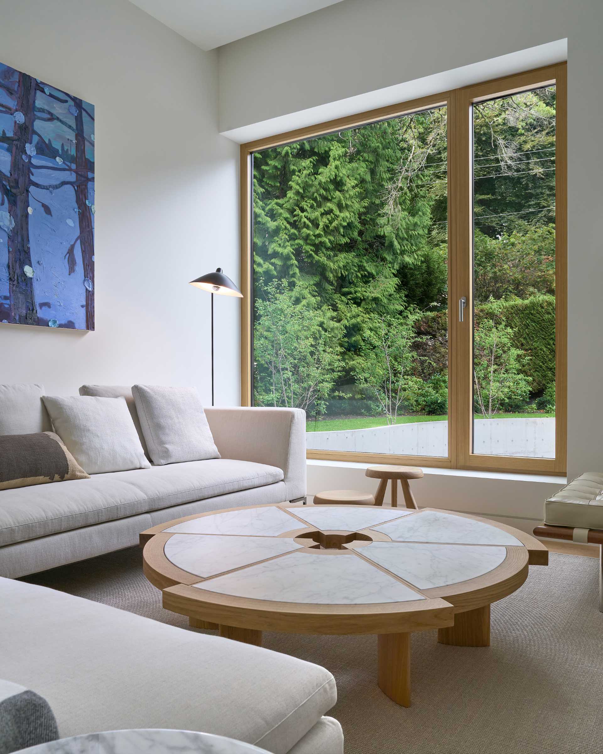 A serene interior palette of oak floors, oak windows, and oak millwork, complemented by natural stone finishes throughout.
