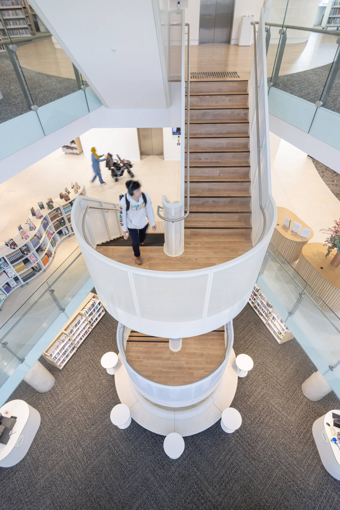 The centrally located stairs inside a modern library.