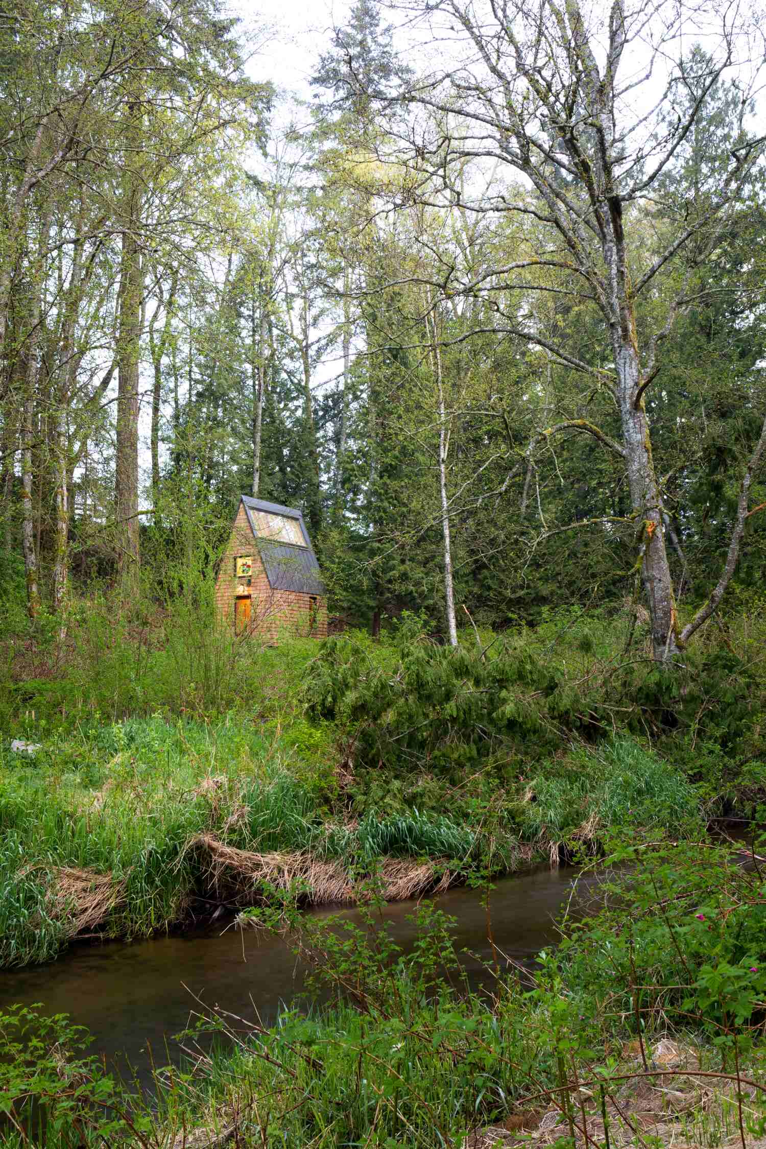 A small shingle-clad chapel.